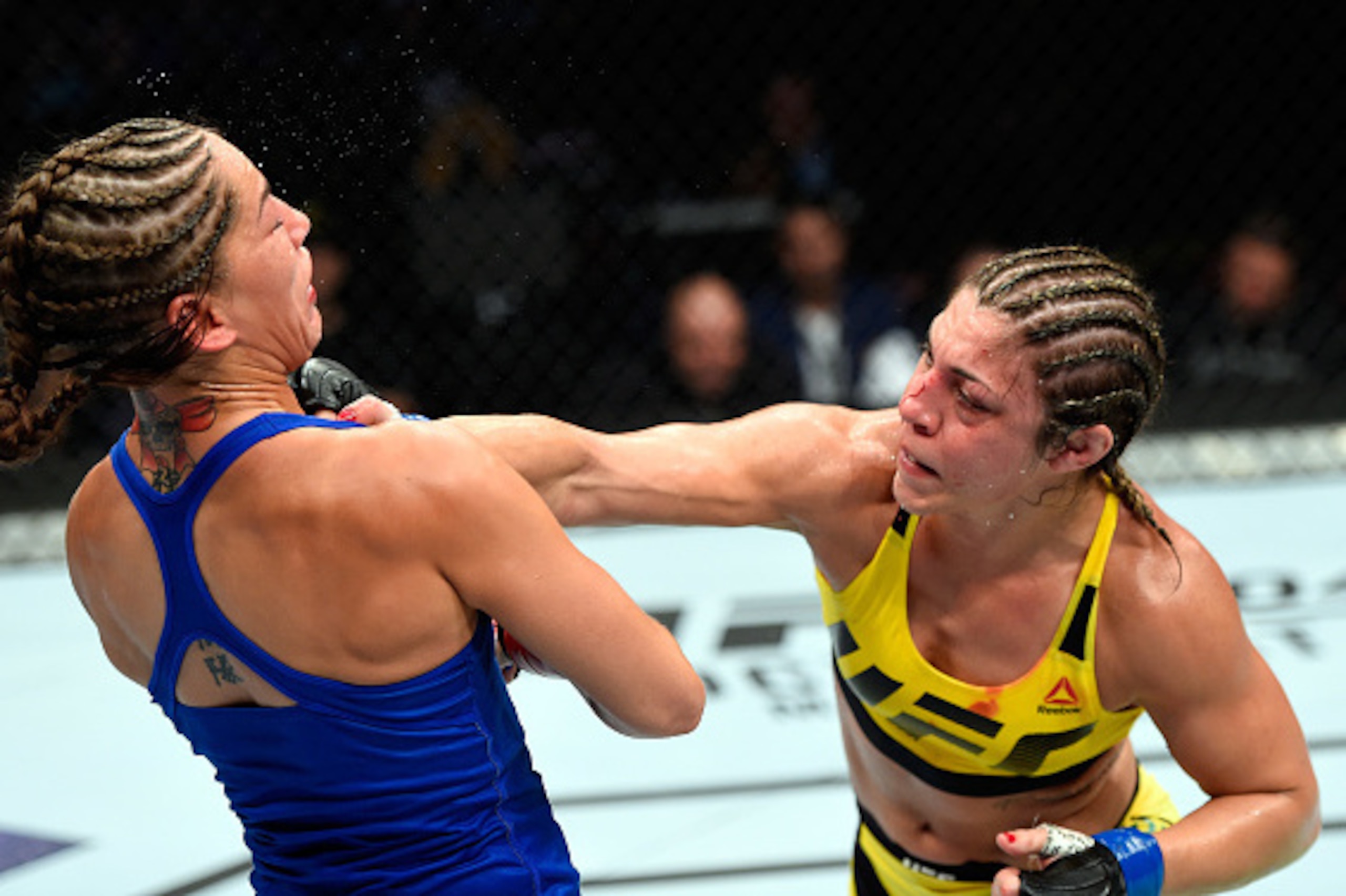 CLEVELAND, OH - SEPTEMBER 10: (R-L) Bethe Correia of Brazil punches Jessica Eye in their women's bantamweight bout during the UFC 203 event at Quicken Loans Arena on September 10, 2016 in Cleveland, Ohio. (Photo by Josh Hedges/Zuffa LLC/Zuffa LLC via Get CLEVELAND, OH - SEPTEMBER 10: (R-L) Bethe Correia of Brazil punches Jessica Eye in their women's bantamweight bout during the UFC 203 event at Quicken Loans Arena on September 10, 2016 in Cleveland, Ohio. (Photo by Josh Hedges/Zuffa LLC/Zuffa LLC via Get