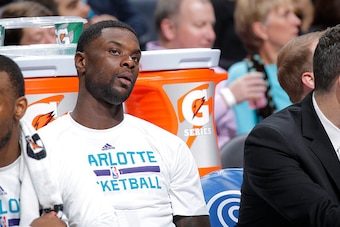 CHARLOTTE, NC - MARCH 28: Lance Stephenson #1 of the Charlotte Hornets looks on during the game against the Atlanta Hawks on March 28, 2015 at Time Warner Cable Arena in Charlotte, North Carolina. NOTE TO USER: User expressly acknowledges and agrees that,