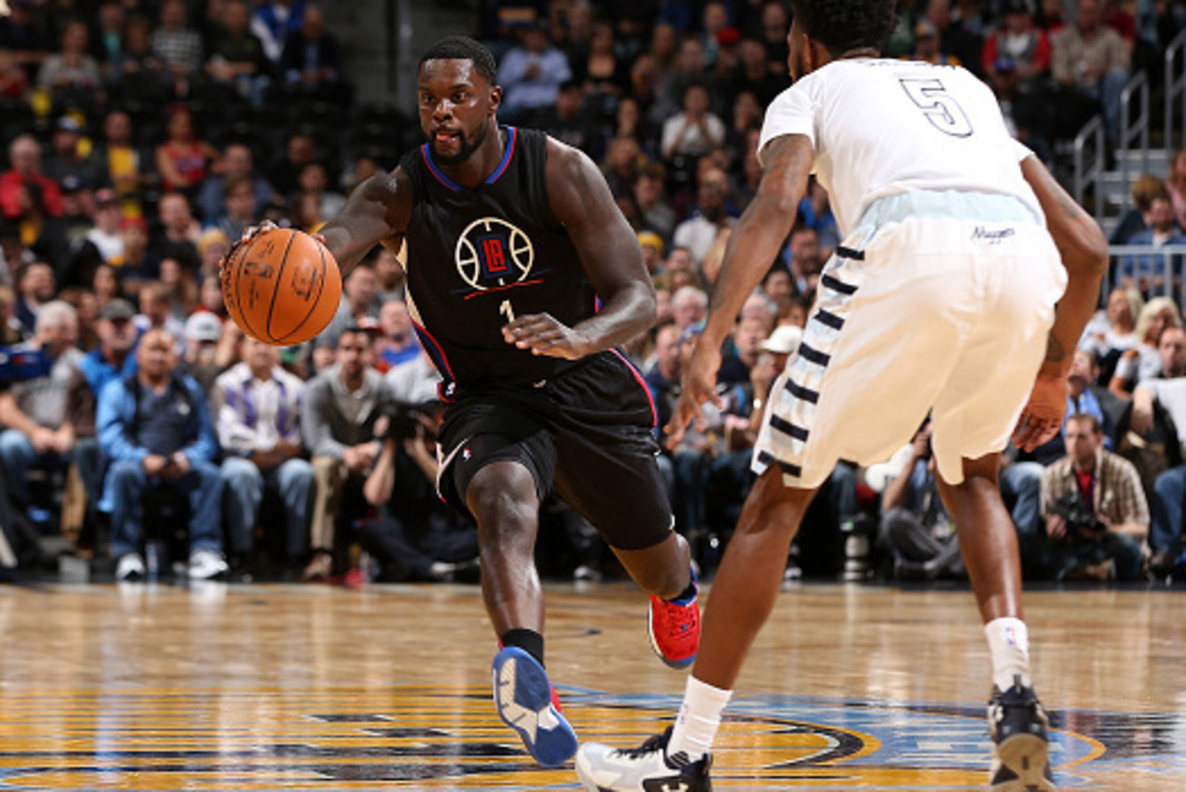 DENVER, CO - NOVEMBER 24: Lance Stephenson #1 of the Los Angeles Clippers controls the ball against Will Barton #5 of the Denver Nuggets at Pepsi Center on November 24, 2015 in Denver, Colorado. NOTE TO USER: User expressly acknowledges and agrees that, DENVER, CO - NOVEMBER 24: Lance Stephenson #1 of the Los Angeles Clippers controls the ball against Will Barton #5 of the Denver Nuggets at Pepsi Center on November 24, 2015 in Denver, Colorado. NOTE TO USER: User expressly acknowledges and agrees that,