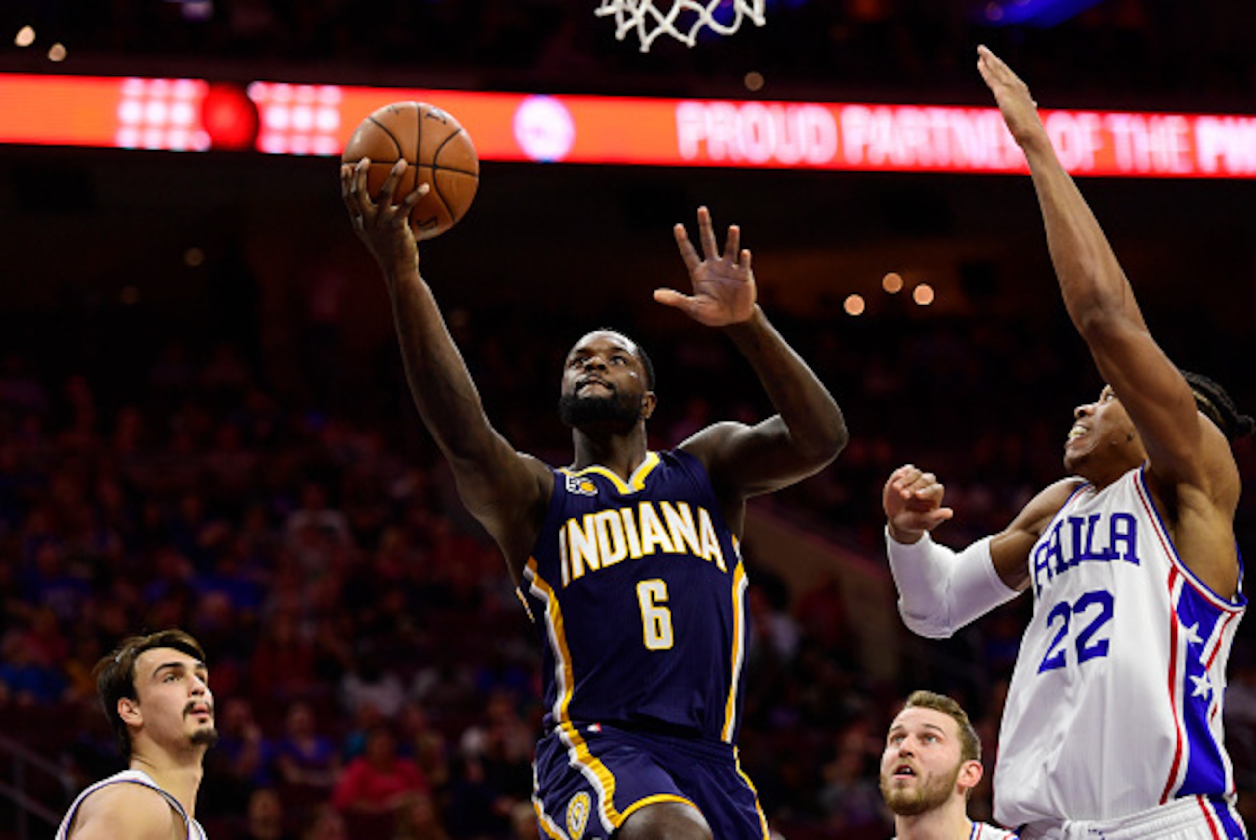 PHILADELPHIA, PA - APRIL 10: Lance Stephenson #6 of the Indiana Pacers hits a layup against Richaun Holmes #22 as Dario Saric #9 (L) and Nik Stauskas #11 (bottom right) of the Philadelphia 76ers looks on during the fourth quarter at the Wells Fargo Center