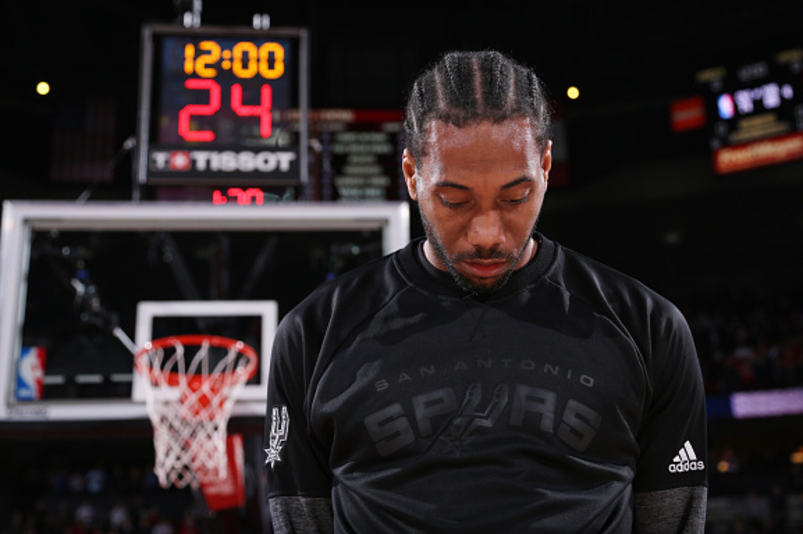 PORTLAND, OR - APRIL 10: Kawhi Leonard #2 of the San Antonio Spurs stands for the National Anthem before a game against the Portland Trail Blazers on April 10, 2017 at the Moda Center in Portland, Oregon. NOTE TO USER: User expressly acknowledges and agr PORTLAND, OR - APRIL 10: Kawhi Leonard #2 of the San Antonio Spurs stands for the National Anthem before a game against the Portland Trail Blazers on April 10, 2017 at the Moda Center in Portland, Oregon. NOTE TO USER: User expressly acknowledges and agr