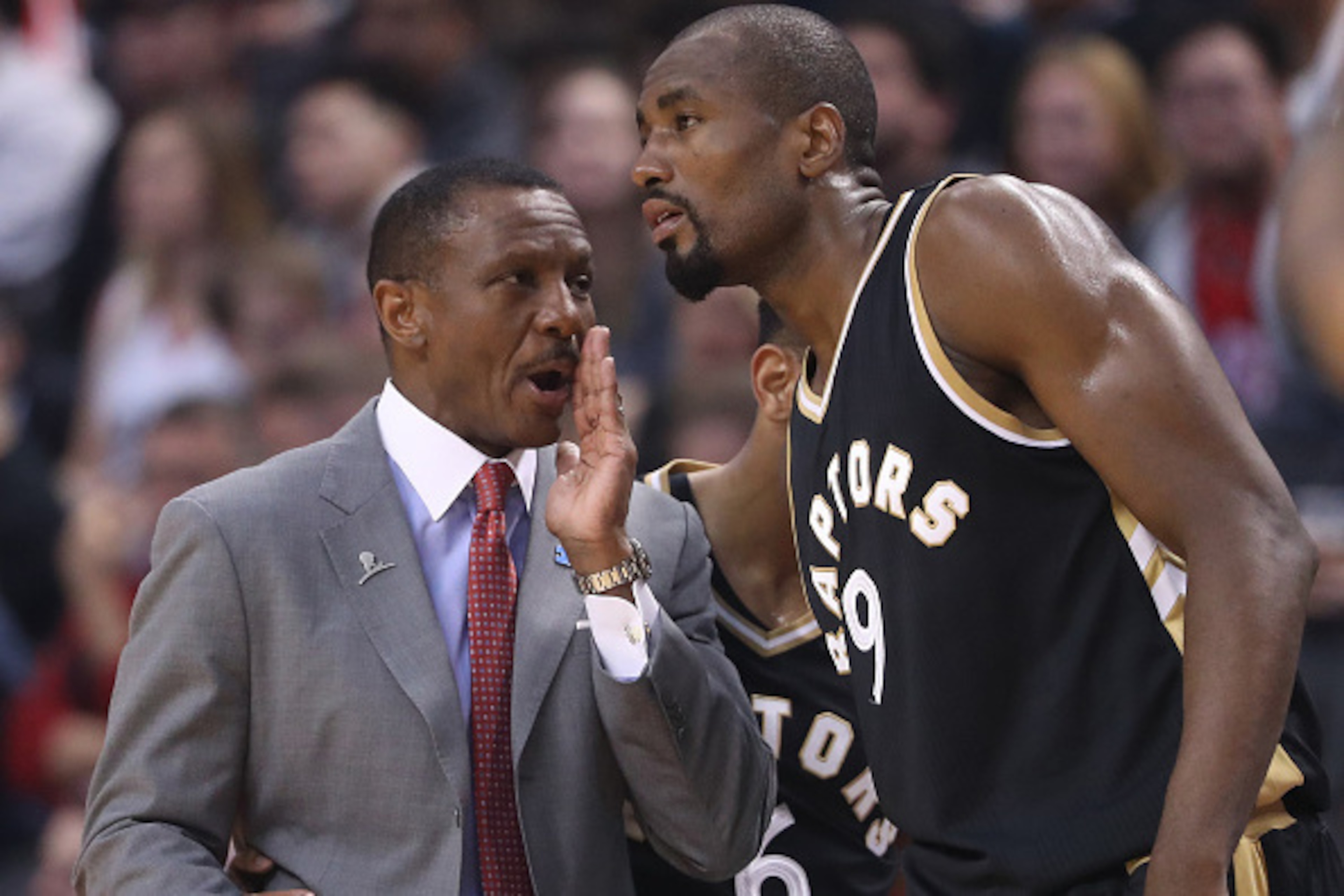 TORONTO, ON - APRIL 02: Head coach Dwane Casey of the Toronto Raptors talks to Serge Ibaka #9 against the Philadelphia 76ers during NBA game action at Air Canada Centre on April 2, 2017 in Toronto, Canada. NOTE TO USER: User expressly acknowledges and agr