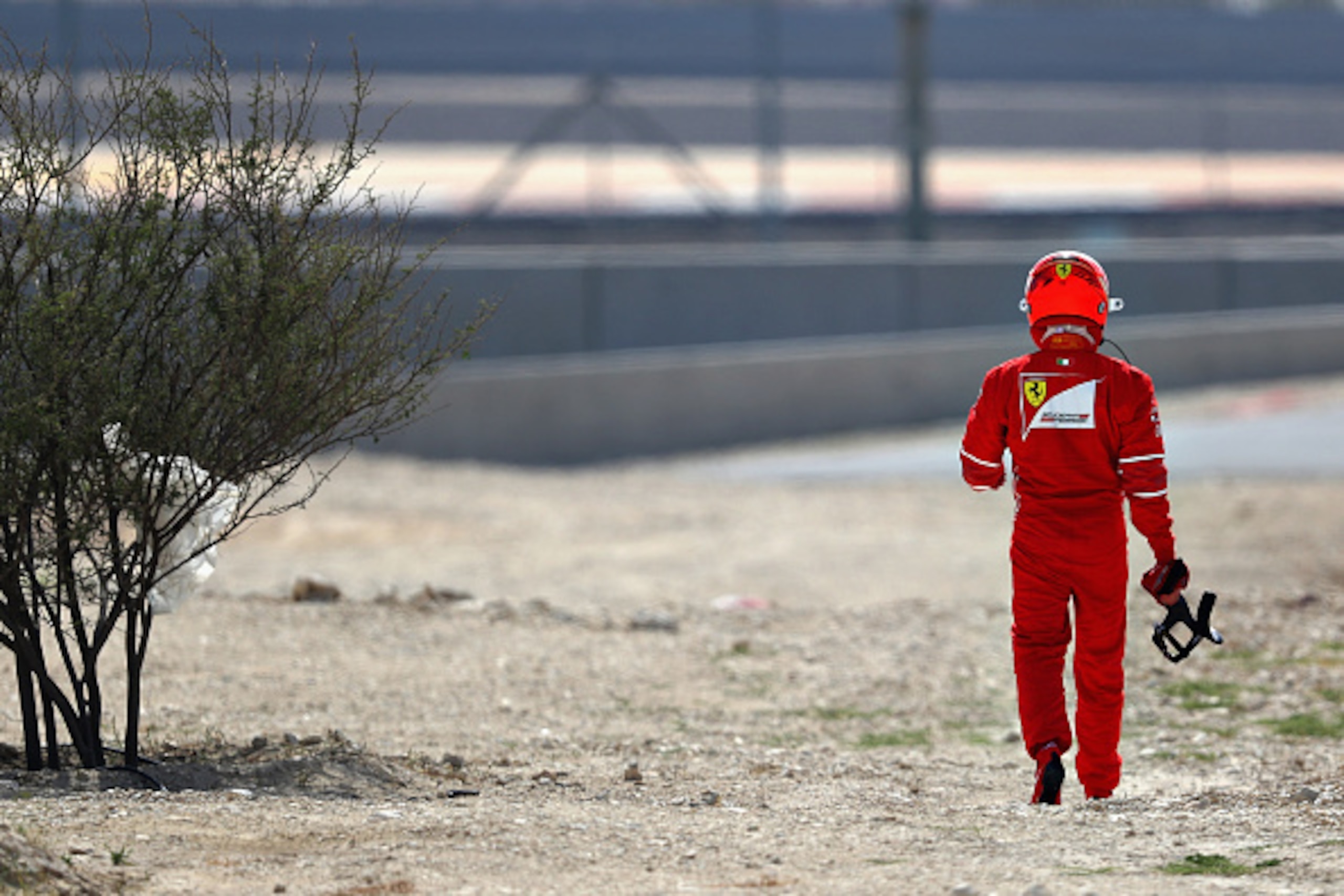 BAHRAIN, BAHRAIN - APRIL 14: Kimi Raikkonen of Finland and Ferrari walks away after breaking down on track during practice for the Bahrain Formula One Grand Prix at Bahrain International Circuit on April 14, 2017 in Bahrain, Bahrain. (Photo by Clive Maso BAHRAIN, BAHRAIN - APRIL 14: Kimi Raikkonen of Finland and Ferrari walks away after breaking down on track during practice for the Bahrain Formula One Grand Prix at Bahrain International Circuit on April 14, 2017 in Bahrain, Bahrain. (Photo by Clive Maso