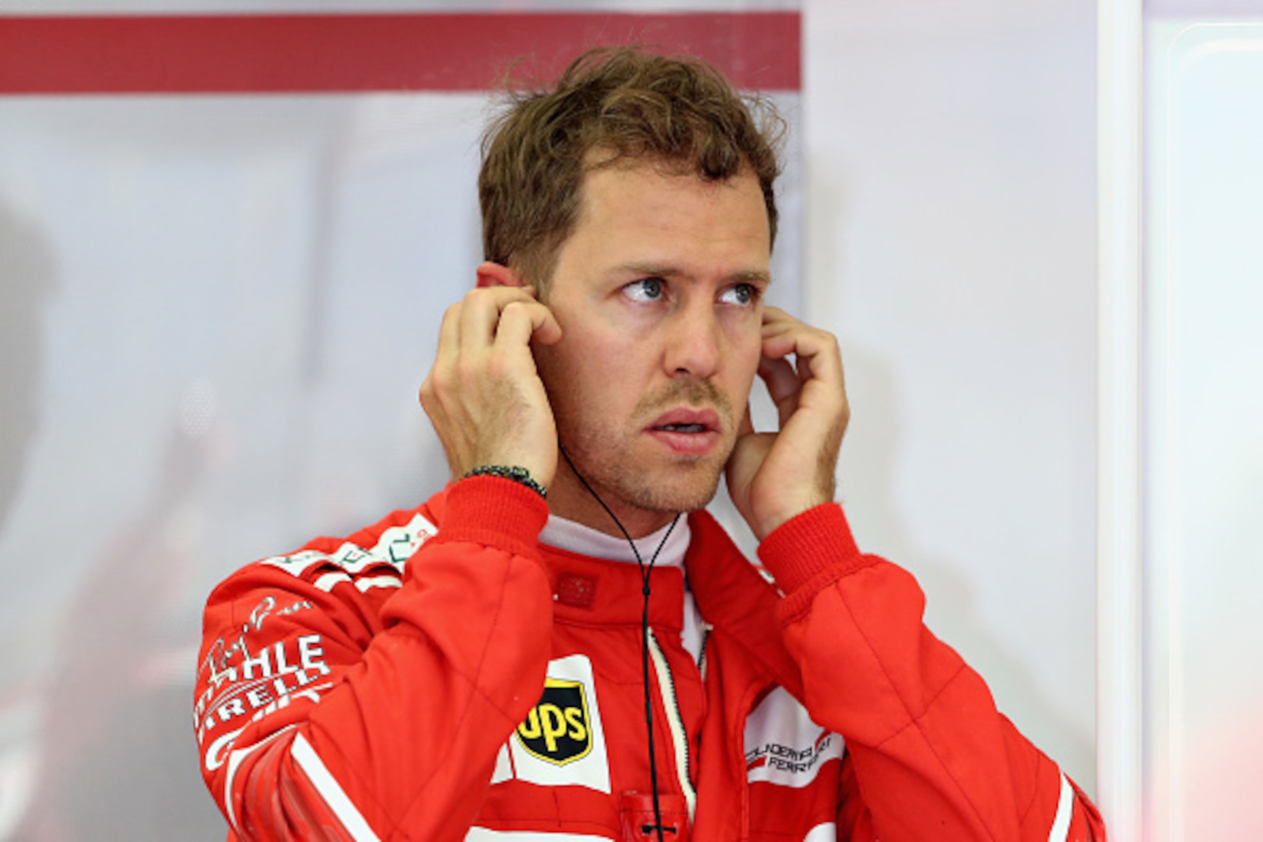 BAHRAIN, BAHRAIN - APRIL 14: Sebastian Vettel of Germany and Ferrari prepares to drive in the garage during practice for the Bahrain Formula One Grand Prix at Bahrain International Circuit on April 14, 2017 in Bahrain, Bahrain. (Photo by Lars Baron/Gett BAHRAIN, BAHRAIN - APRIL 14: Sebastian Vettel of Germany and Ferrari prepares to drive in the garage during practice for the Bahrain Formula One Grand Prix at Bahrain International Circuit on April 14, 2017 in Bahrain, Bahrain. (Photo by Lars Baron/Gett