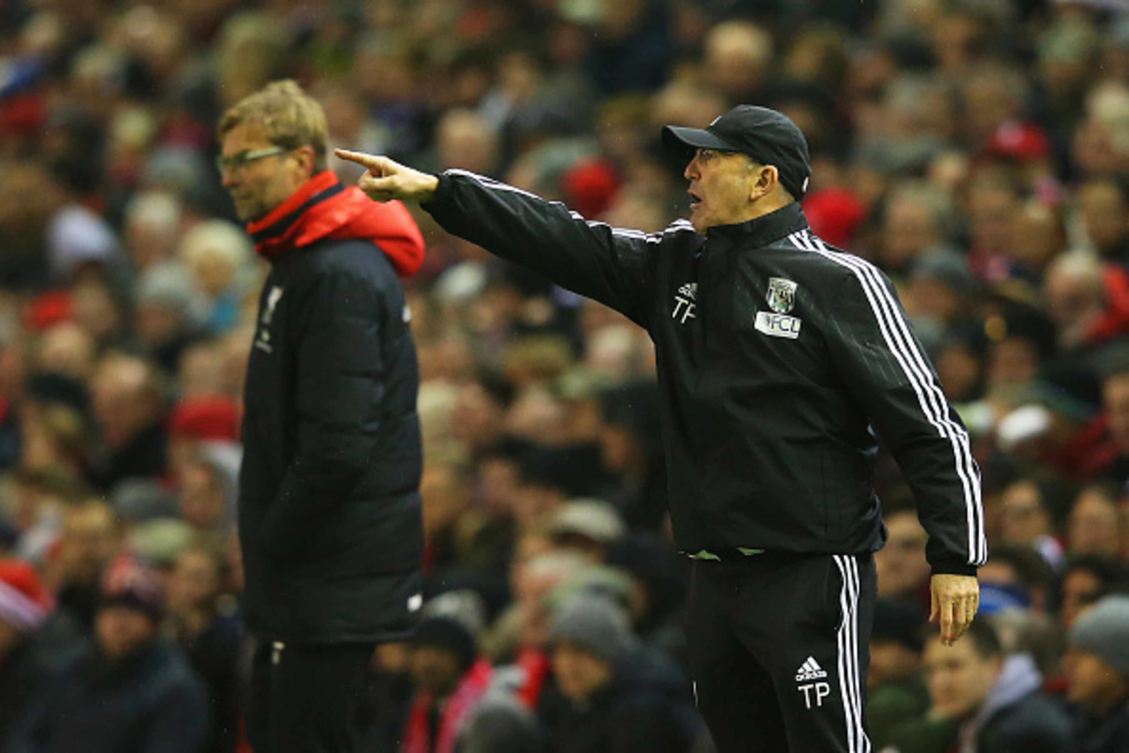 LIVERPOOL, ENGLAND - DECEMBER 13:  Tony Pulis, manager of West Bromwich Albion points as Jurgen Klopp, manager of Liverpool looks on during the Barclays Premier League match between Liverpool and West Bromwich Albion at Anfield on December 13, 2015 in Liv