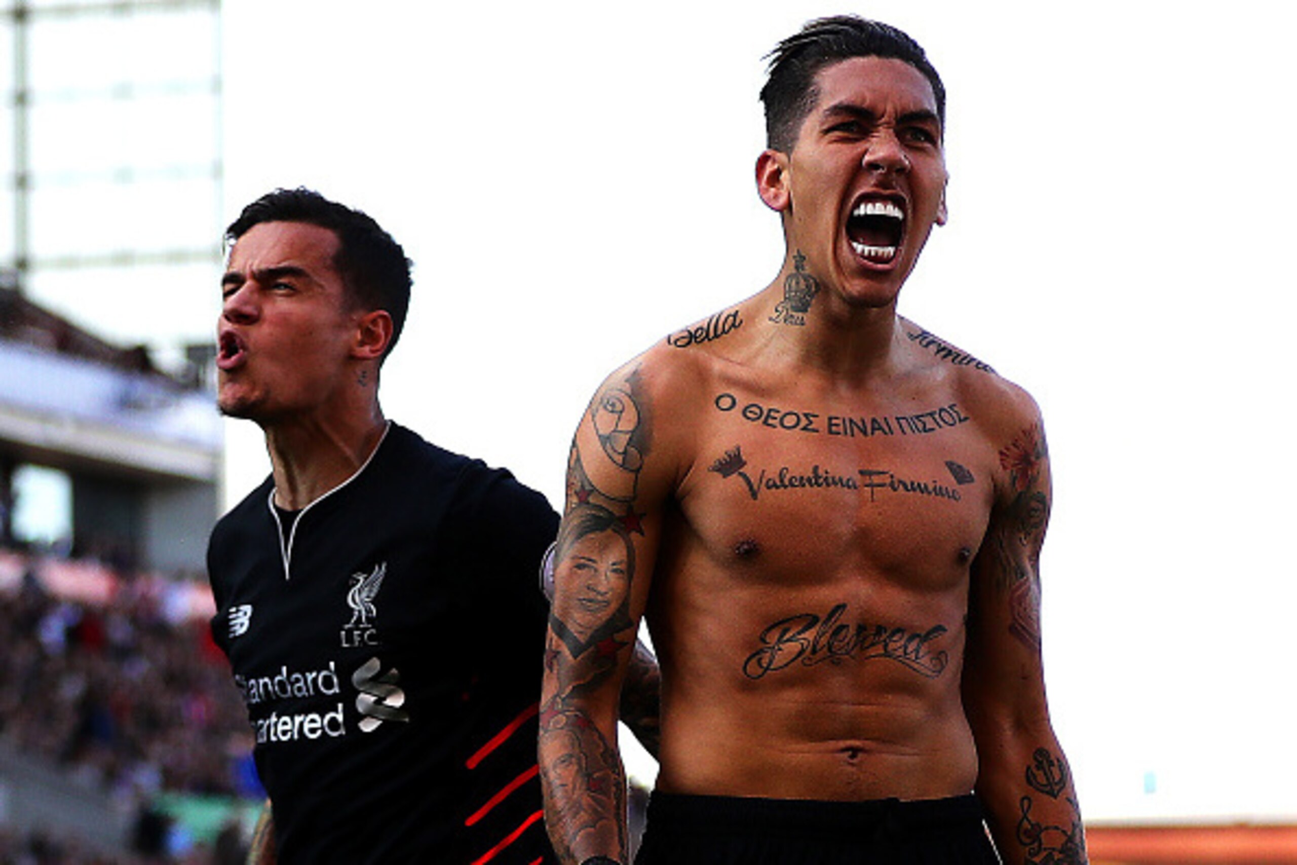 STOKE ON TRENT, ENGLAND - APRIL 08: Roberto Firmino of Liverpool celebrates scoring his side's second goal with team-mate Philippe Coutinho during the Premier League match between Stoke City and Liverpool at Bet365 Stadium on April 8, 2017 in Stoke on Tre