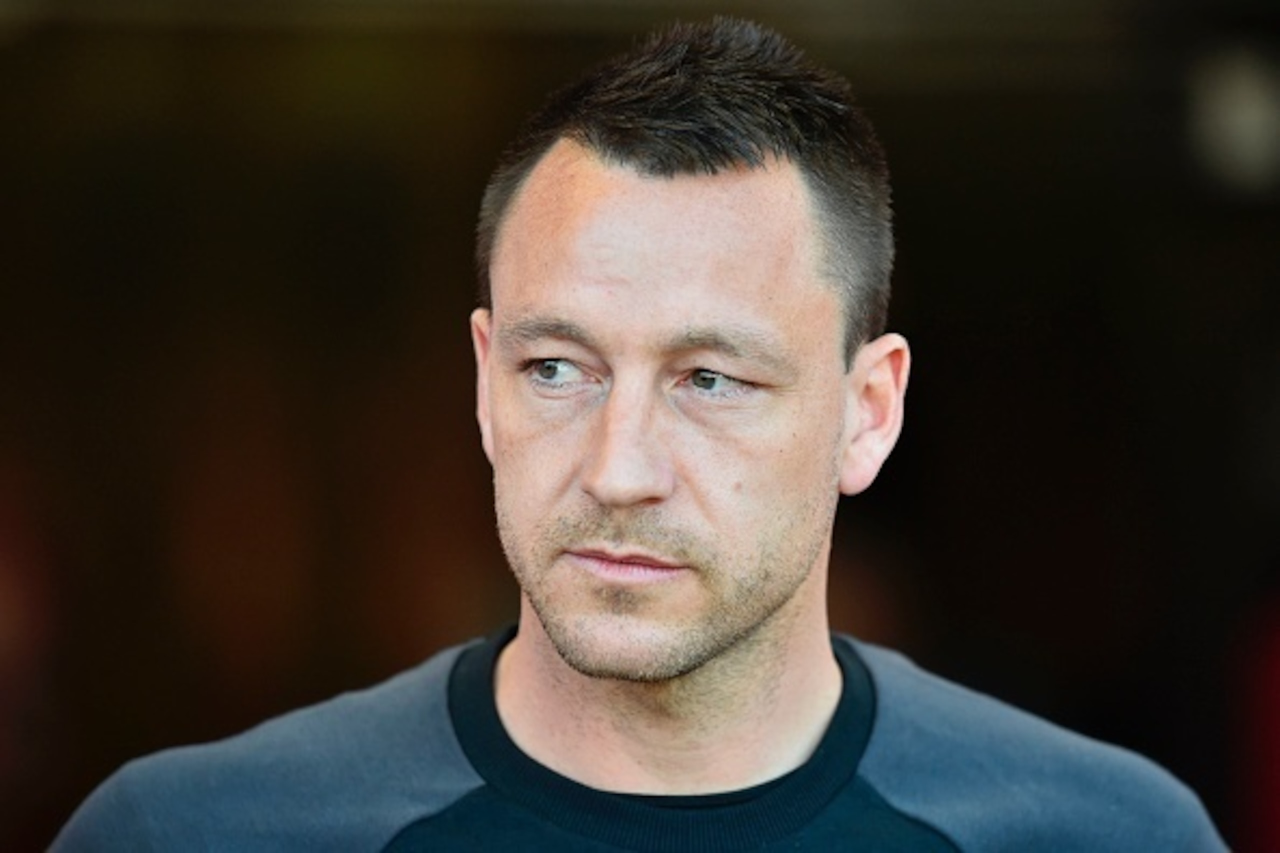 Chelsea's English defender John Terry is seen ahead of the English Premier League football match between Bournemouth and Chelsea at the Vitality Stadium in Bournemouth, southern England on April 8, 2017. / AFP PHOTO / Glyn KIRK / RESTRICTED TO EDITORIAL U