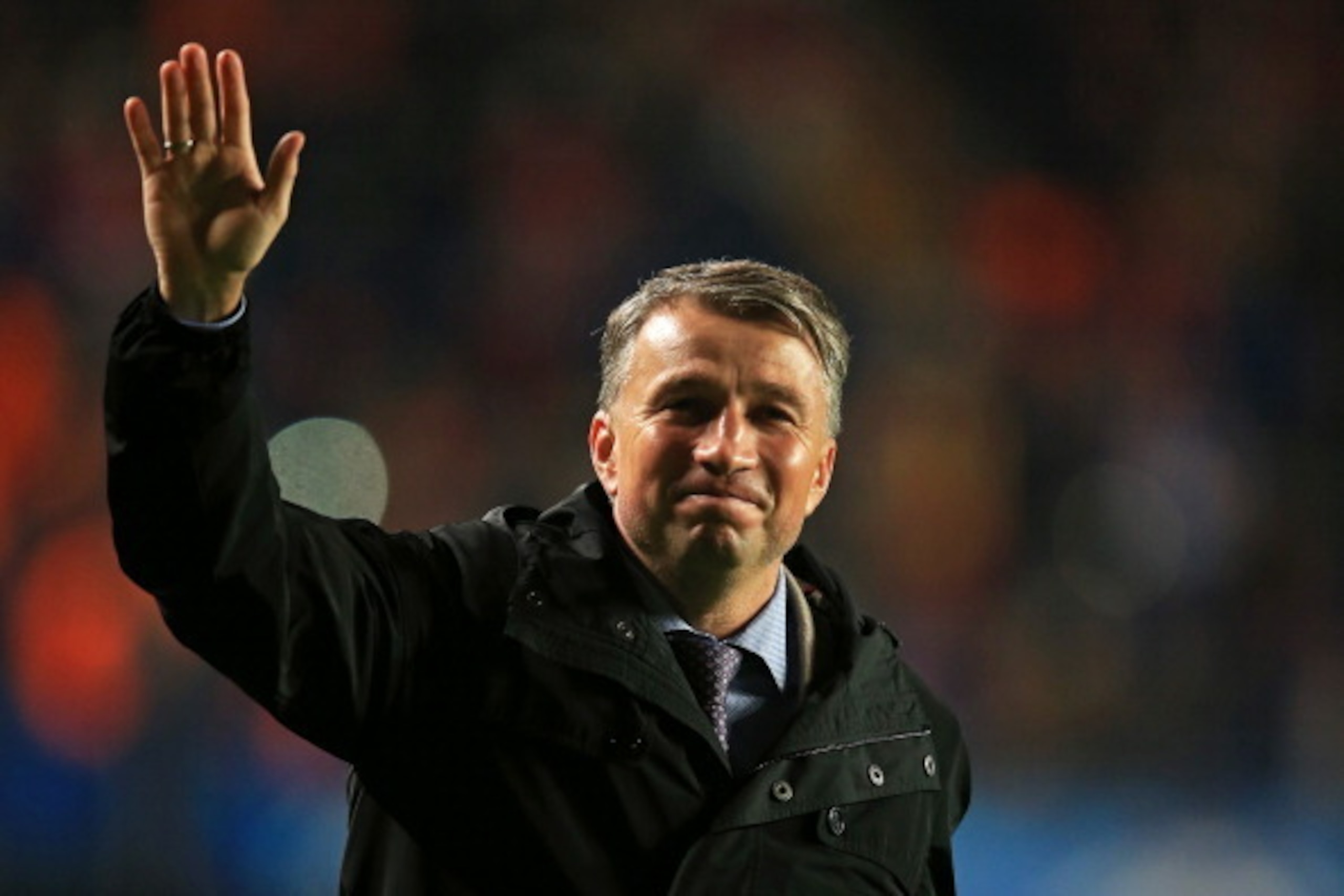 LONDON, ENGLAND - DECEMBER 11:  Former Chelsea and Romania player Dan Petrescu waves to the fans at half time during the UEFA Champions League Group E match between Chelsea and FC Steaua Bucuresti at Stamford Bridge on December 11, 2013 in London, England