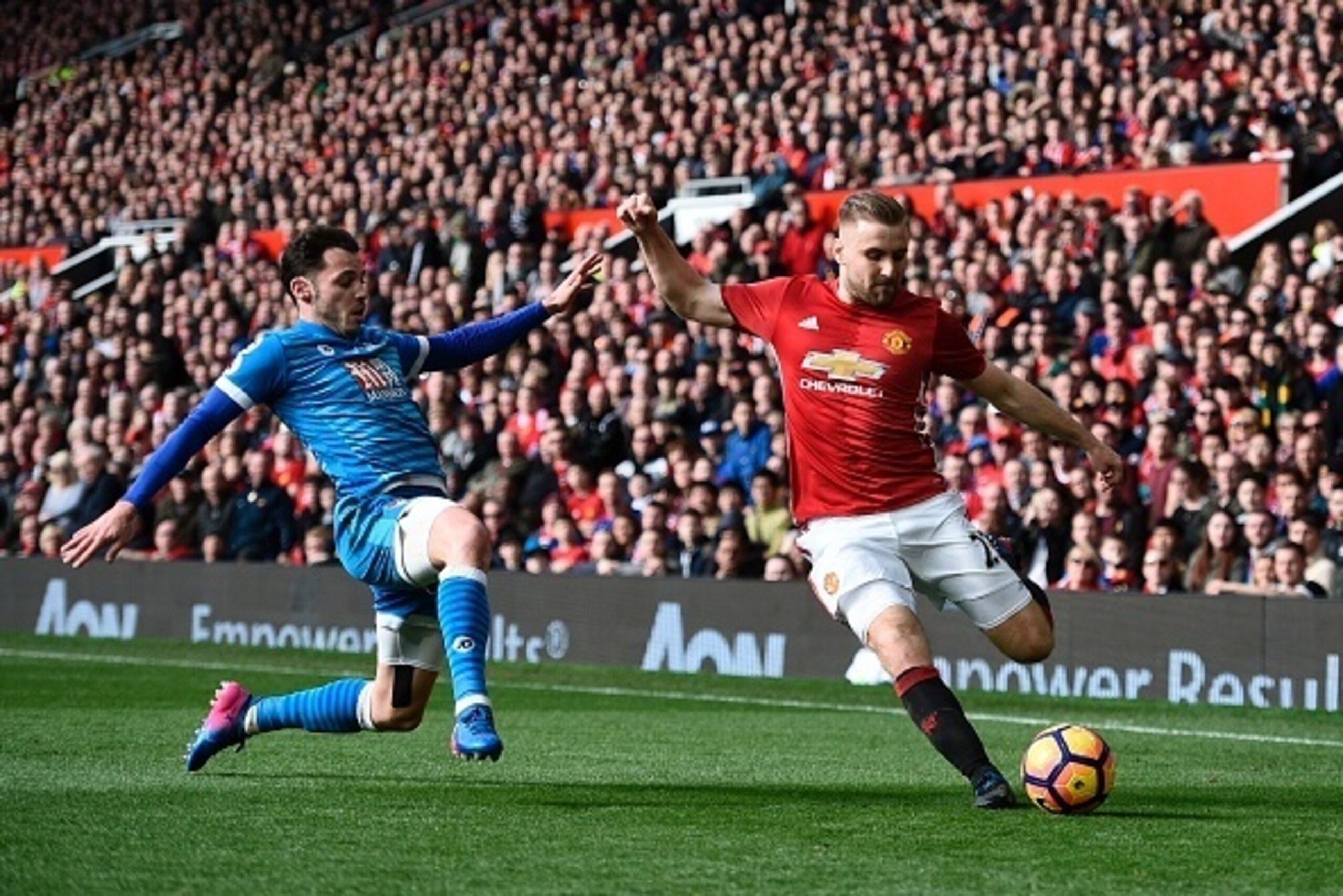 Manchester United's English defender Luke Shaw (R) vies with Bournemouth's English defender Adam Smith (L) during the English Premier League football match between Manchester United and Bournemouth at Old Trafford in Manchester, north west England, on Mar