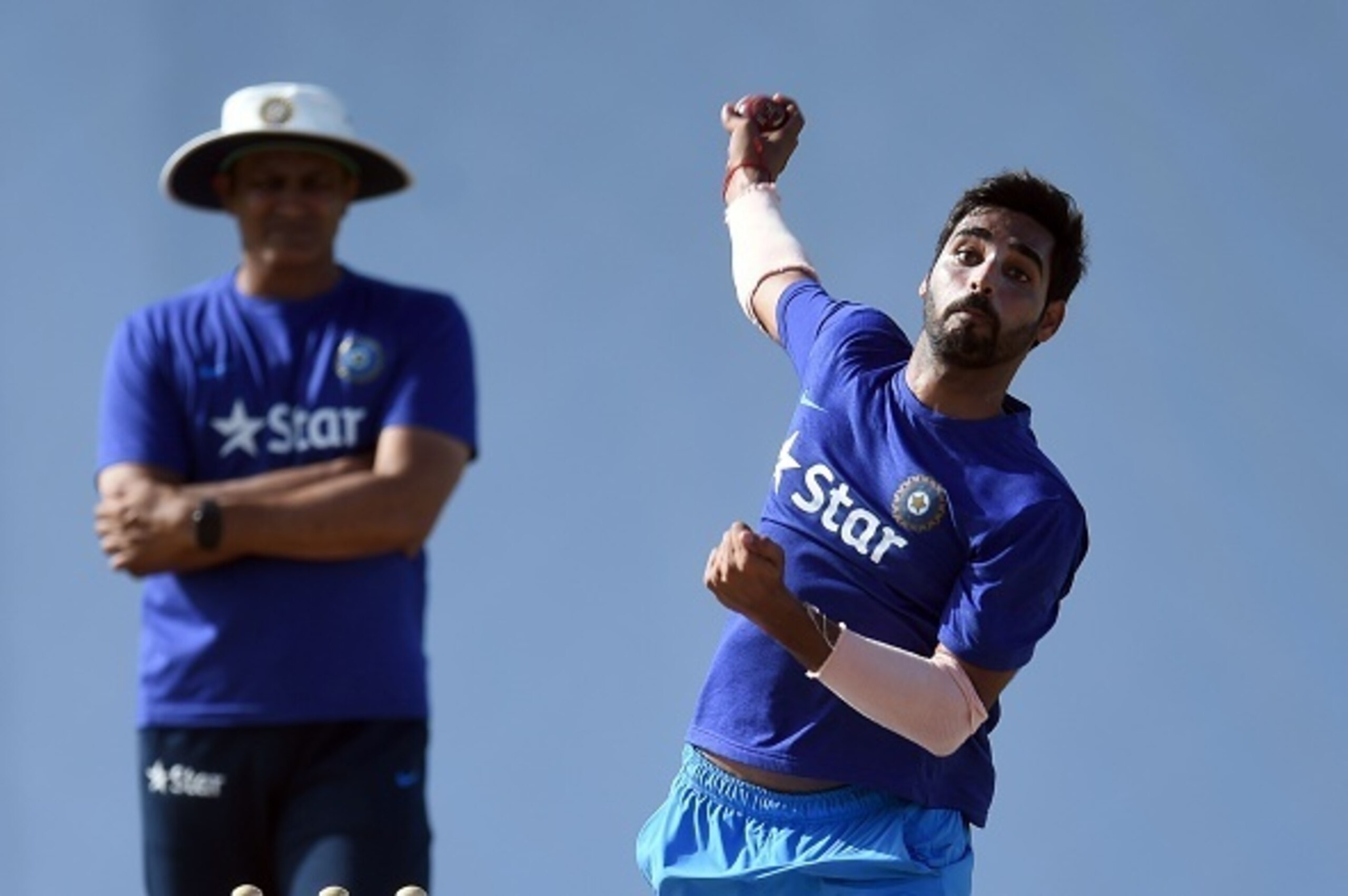 Indian cricketer Bhuvneshwar Kumar delivers a ball while practicing at the end of the three-day tour match between India and WICB President's XI squad at the Warner Park stadium in Basseterre, Saint Kitts, on July 16, 2016. / AFP / Jewel SAMAD        (Pho