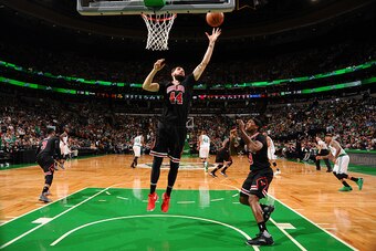 BOSTON, MA - APRIL 16:  Nikola Mirotic #44 of the Chicago Bulls grabs the rebound against the Boston Celtics during the Eastern Conference Quarter-finals of the 2017 NBA Playoffs on April 16, 2017 at TD Garden in Boston, MA. NOTE TO USER: User expressly a