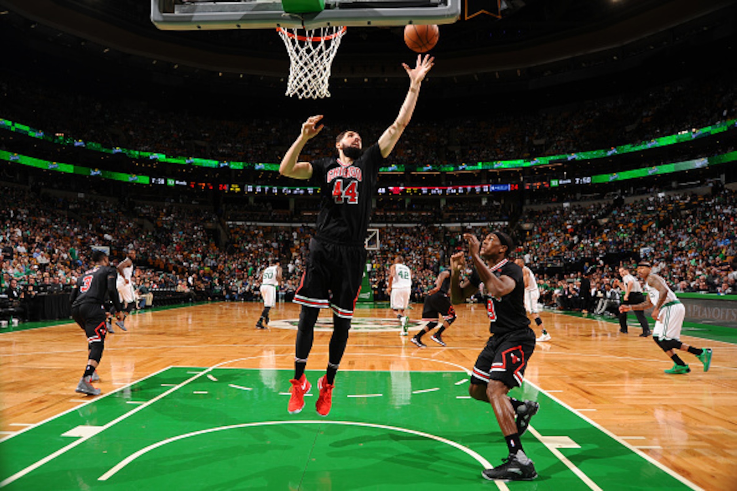 BOSTON, MA - APRIL 16:  Nikola Mirotic #44 of the Chicago Bulls grabs the rebound against the Boston Celtics during the Eastern Conference Quarter-finals of the 2017 NBA Playoffs on April 16, 2017 at TD Garden in Boston, MA. NOTE TO USER: User expressly a