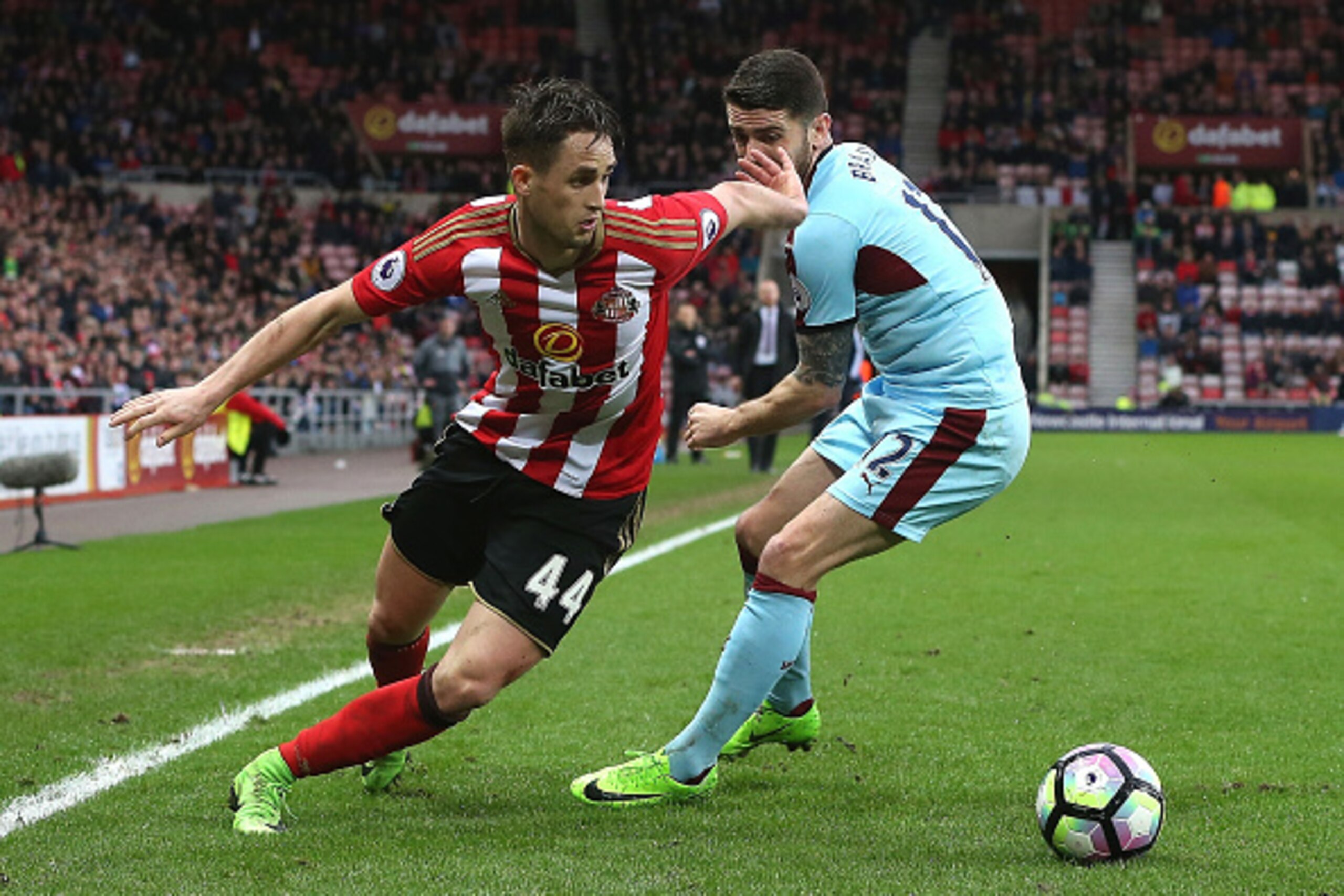 SUNDERLAND, ENGLAND - MARCH 18: Adnan Januzaj of Sunderland (L) attempts to take the balll past Robbie Brady of Burnley (R) during the Premier League match between Sunderland and Burnley at Stadium of Light on March 18, 2017 in Sunderland, England. (Phot SUNDERLAND, ENGLAND - MARCH 18: Adnan Januzaj of Sunderland (L) attempts to take the balll past Robbie Brady of Burnley (R) during the Premier League match between Sunderland and Burnley at Stadium of Light on March 18, 2017 in Sunderland, England. (Phot