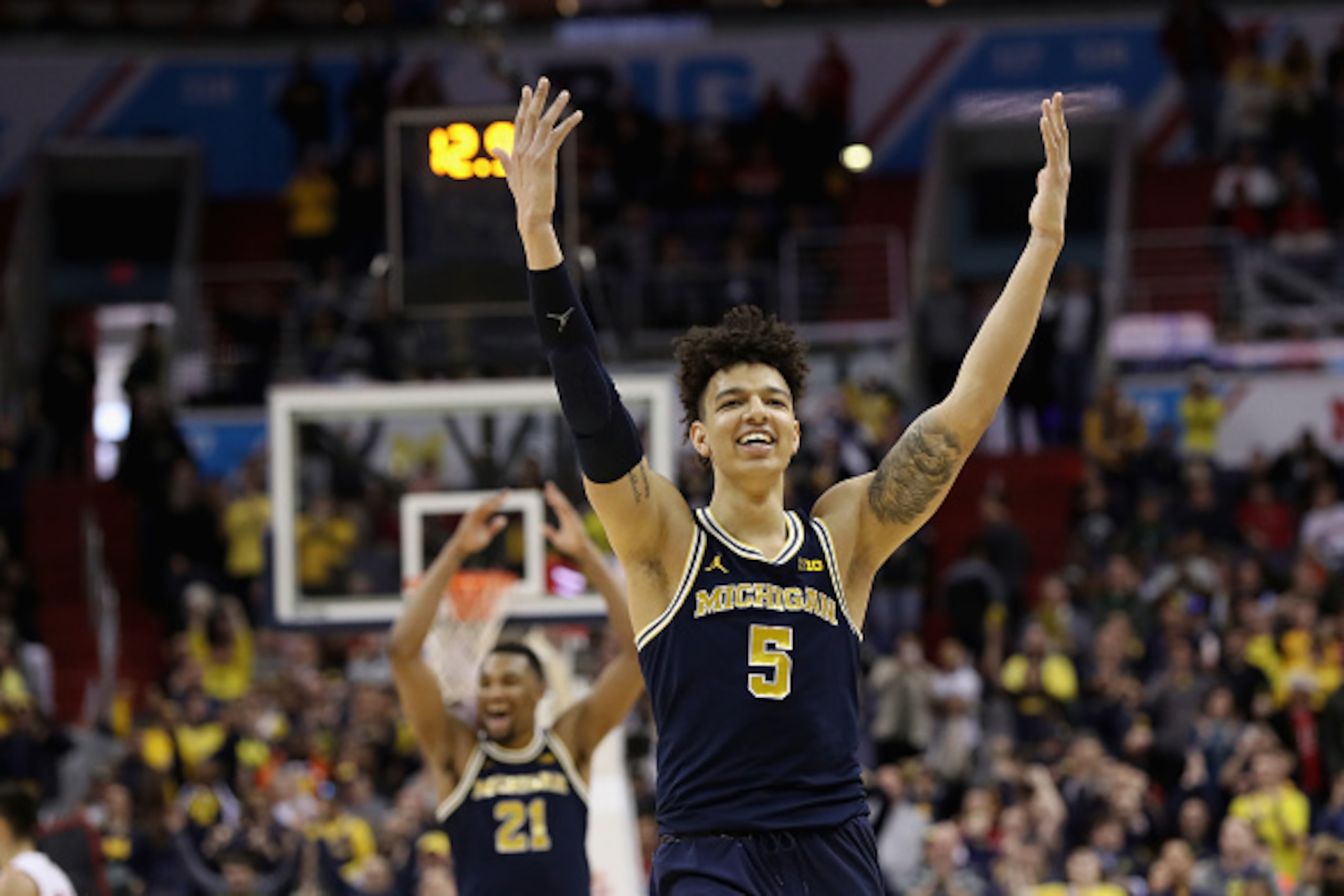 WASHINGTON, DC - MARCH 12: D.J. Wilson #5 of the Michigan Wolverines celebrates during the closing seconds of their 71-56 win over the Wisconsin Badgers to win the Big Ten Basketball Tournament Championship game at Verizon Center on March 12, 2017 in Was WASHINGTON, DC - MARCH 12: D.J. Wilson #5 of the Michigan Wolverines celebrates during the closing seconds of their 71-56 win over the Wisconsin Badgers to win the Big Ten Basketball Tournament Championship game at Verizon Center on March 12, 2017 in Was