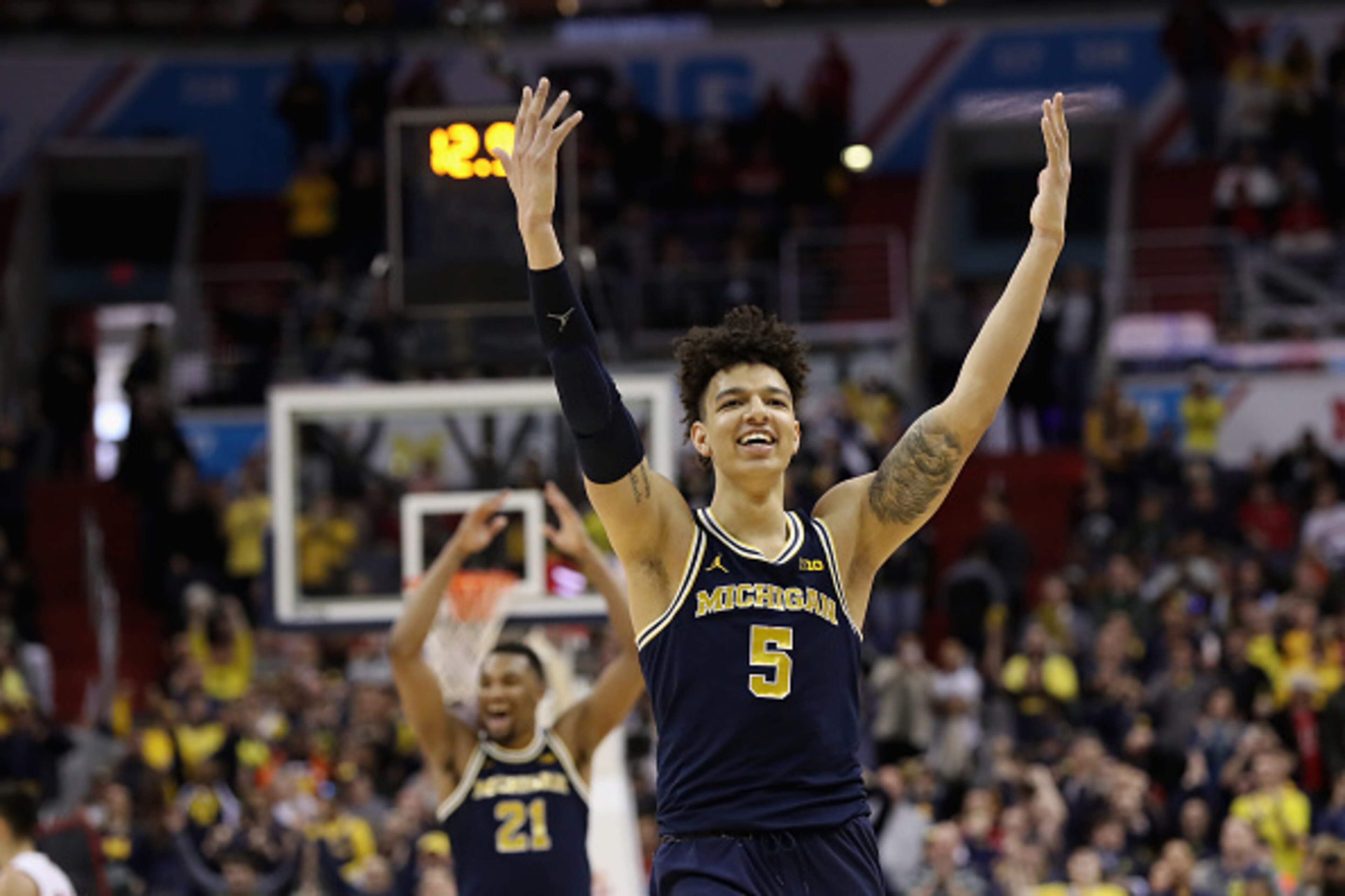 WASHINGTON, DC - MARCH 12:  D.J. Wilson #5 of the Michigan Wolverines celebrates during the closing seconds of their 71-56 win over the Wisconsin Badgers to win the Big Ten Basketball Tournament Championship game at Verizon Center on March 12, 2017 in Was