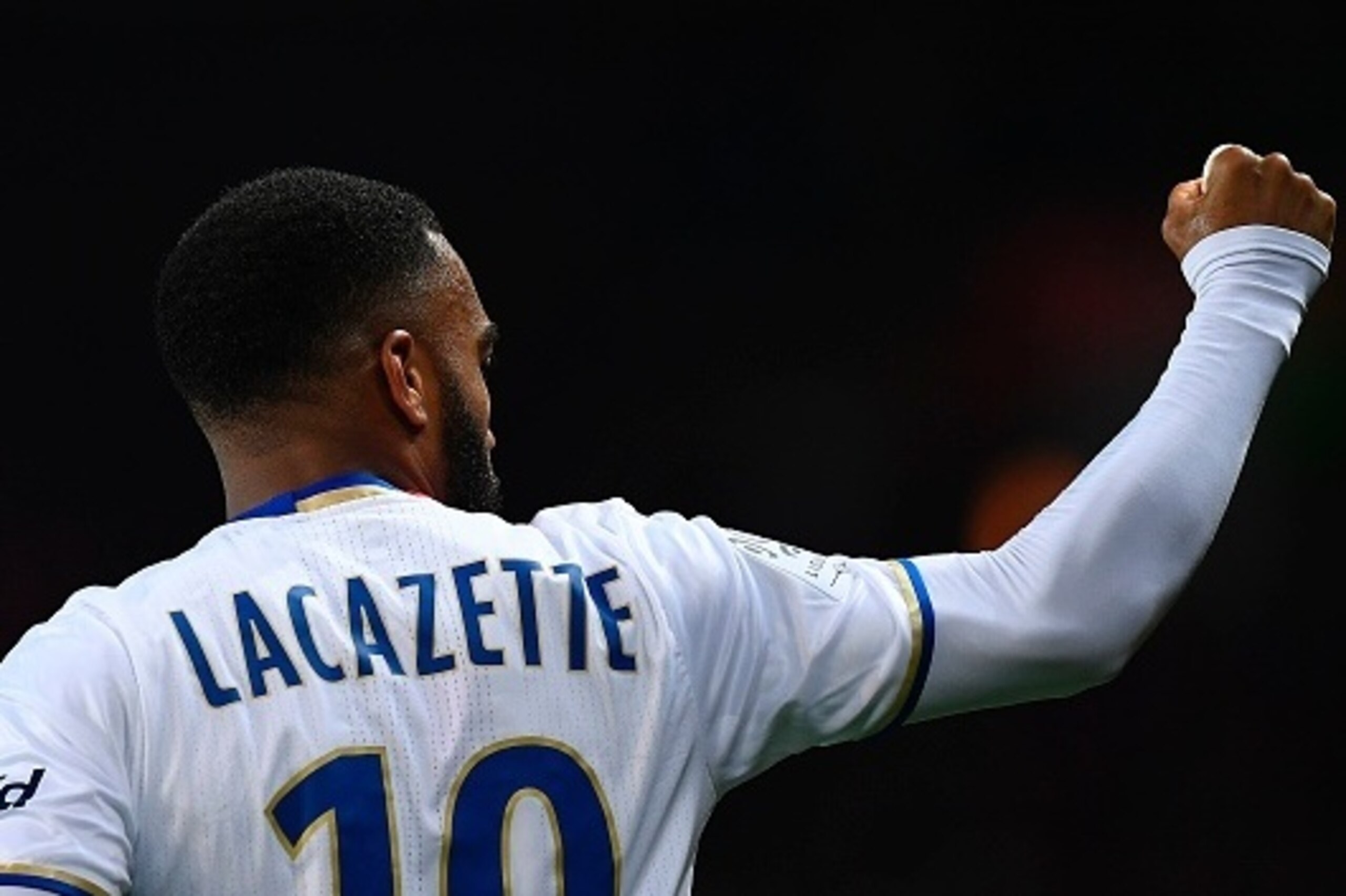 Lyon's French forward Alexandre Lacazette celebrates opening the scoring during the French L1 football match Paris Saint-Germain (PSG) vs Olympique Lyonnais (OL) at the Parc des Princes stadium in Paris on March 19, 2017.  / AFP PHOTO / FRANCK FIFE       