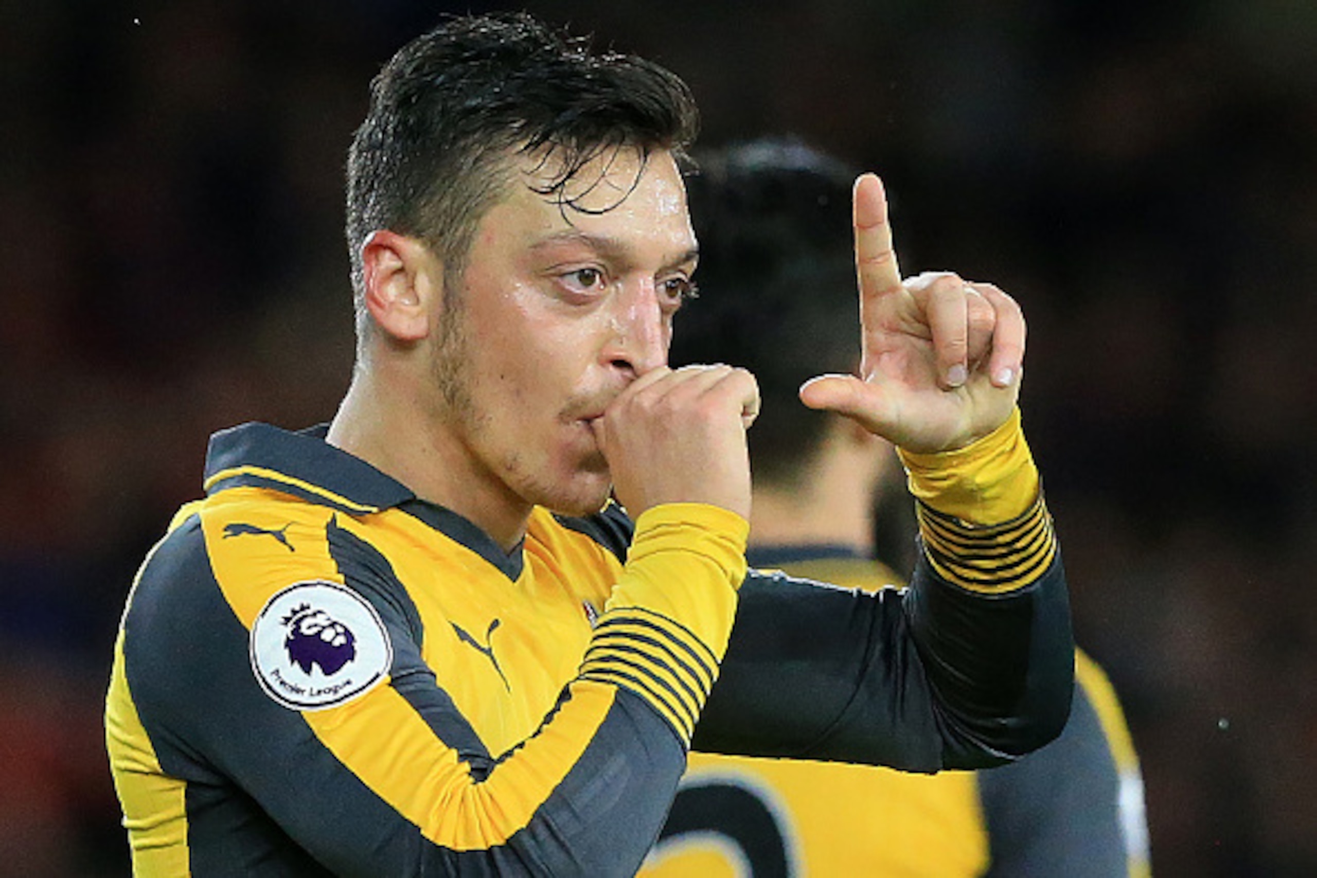 Arsenal's German midfielder Mesut Ozil gestures as he celebrates scoring his team's second goal during the English Premier League football match between Middlesbrough and Arsenal at Riverside Stadium in Middlesbrough, northeast England on April 17, 2017. 