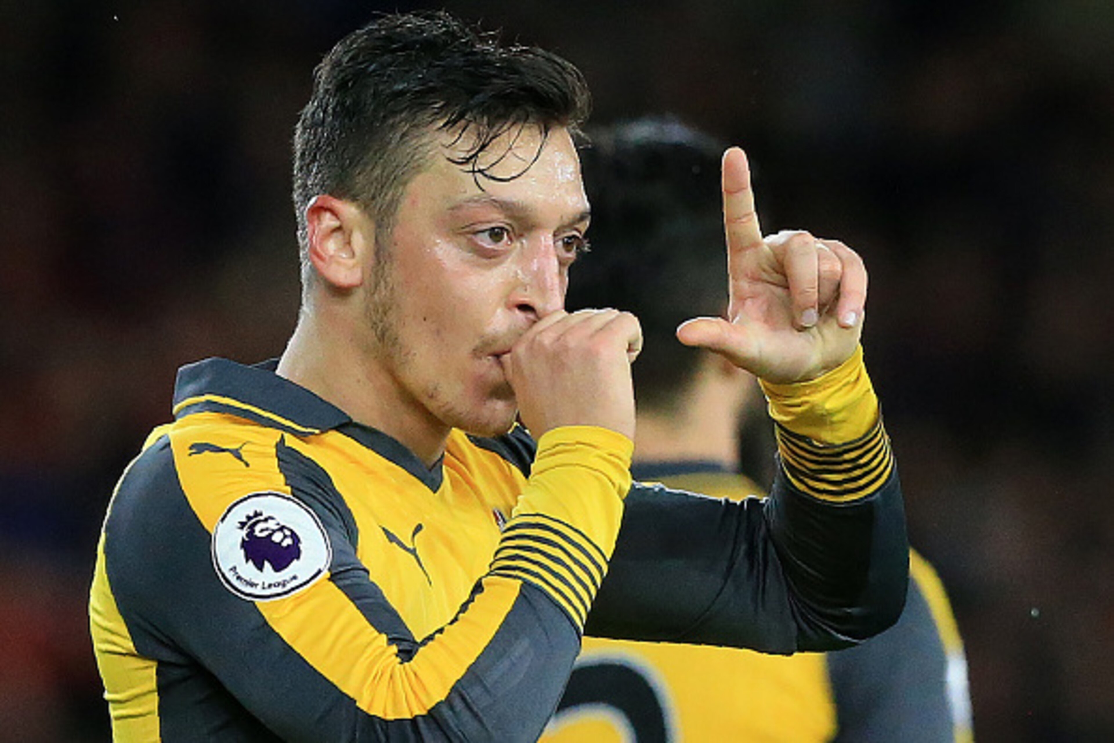 Arsenal's German midfielder Mesut Ozil gestures as he celebrates scoring his team's second goal during the English Premier League football match between Middlesbrough and Arsenal at Riverside Stadium in Middlesbrough, northeast England on April 17, 2017. 