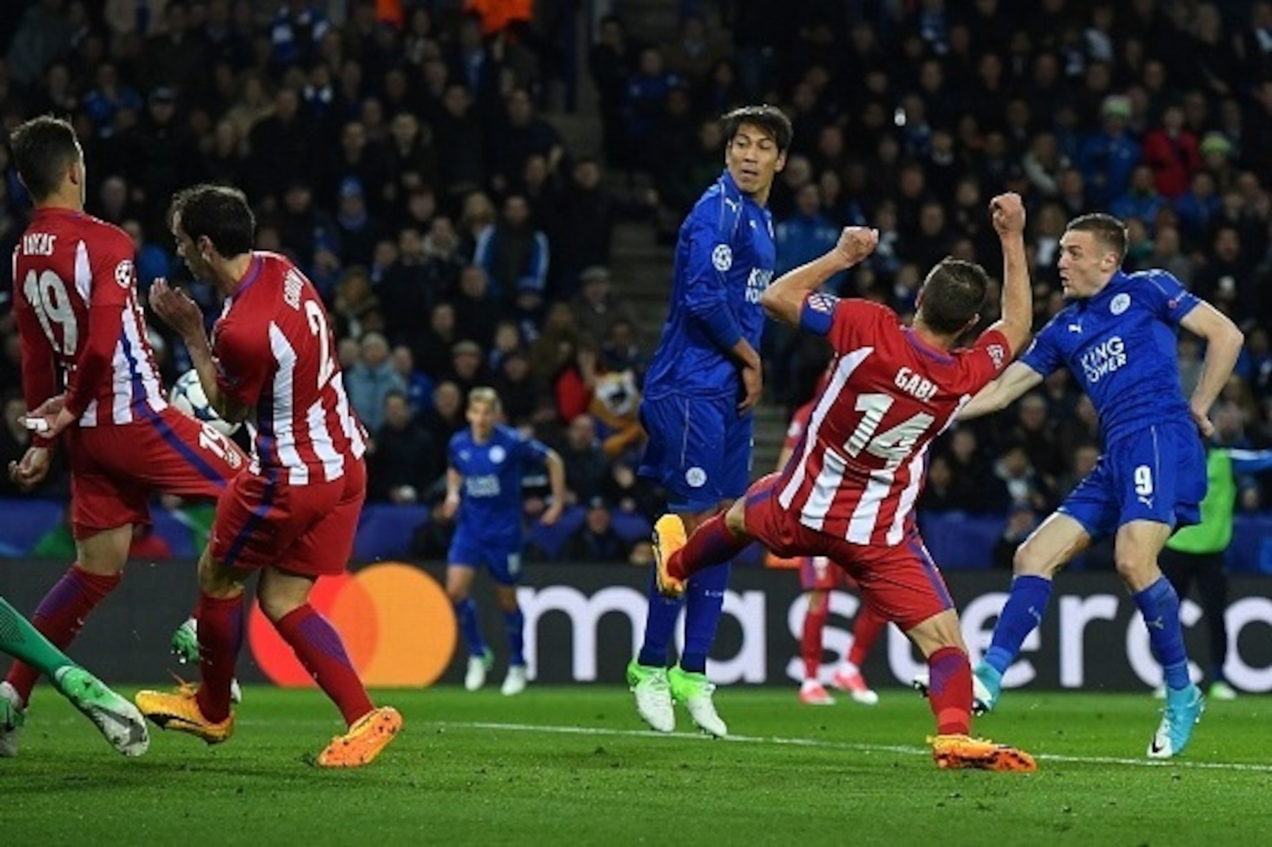 Leicester City's English striker Jamie Vardy (R) scores his team's first goal during the UEFA Champions League quarter-final second leg football match between Leicester City and Club Atletico de Madrid at the King Power stadium in Leicester on April 18, 2 Leicester City's English striker Jamie Vardy (R) scores his team's first goal during the UEFA Champions League quarter-final second leg football match between Leicester City and Club Atletico de Madrid at the King Power stadium in Leicester on April 18, 2