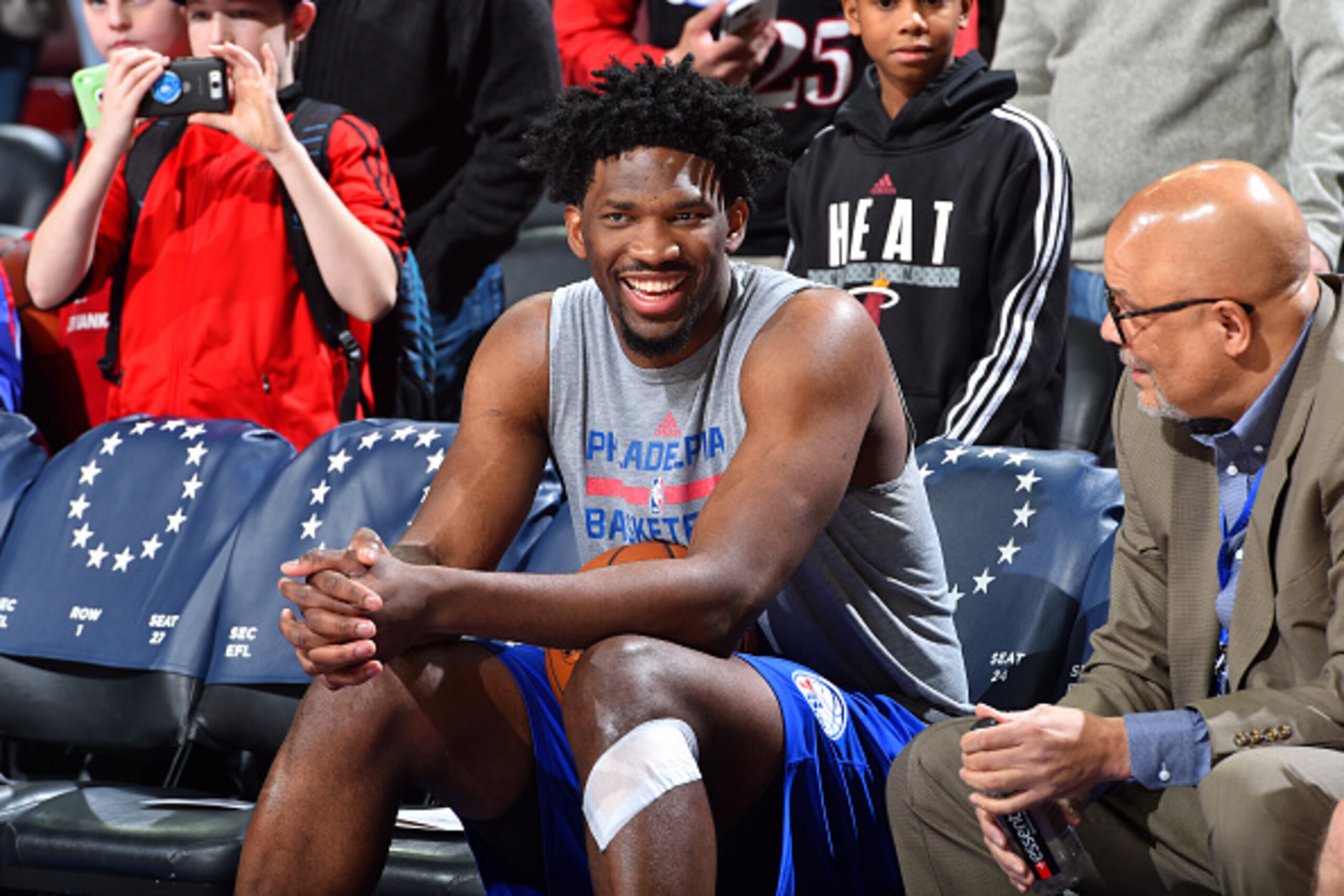 PHILADELPHIA, PA - FEBRUARY 11: Joel Embiid #21 of the Philadelphia 76ers talks with fans before the game against the Miami Heat on February 11, 2017 at Wells Fargo Center in Philadelphia, Pennsylvania. NOTE TO USER: User expressly acknowledges and agrees