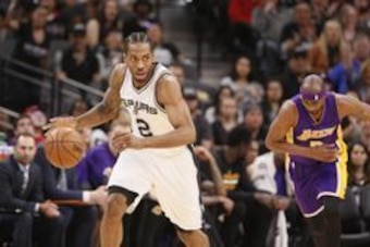 Apr 5, 2017; San Antonio, TX, USA; San Antonio Spurs small forward Kawhi Leonard (2) steals the ball from Los Angeles Lakers small forward Corey Brewer (3) during the first half at AT&T Center. Mandatory Credit: Soobum Im-USA TODAY Sports