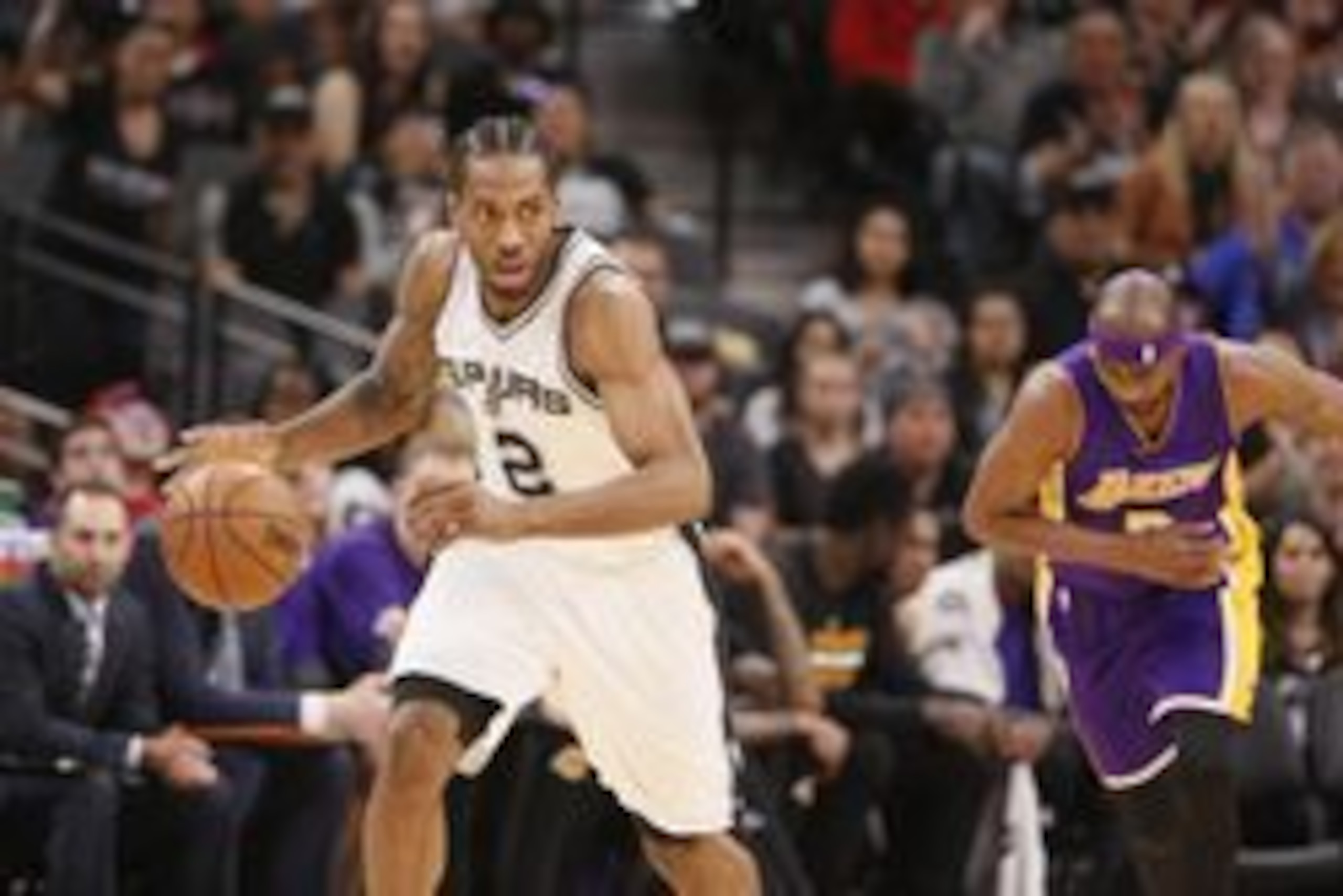 Apr 5, 2017; San Antonio, TX, USA; San Antonio Spurs small forward Kawhi Leonard (2) steals the ball from Los Angeles Lakers small forward Corey Brewer (3) during the first half at AT&T Center. Mandatory Credit: Soobum Im-USA TODAY Sports