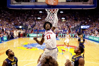 LAWRENCE, KS - FEBRUARY 13:  Josh Jackson #11 of the Kansas Jayhawks dunks during the game against the West Virginia Mountaineers at Allen Fieldhouse on February 13, 2017 in Lawrence, Kansas.  (Photo by Jamie Squire/Getty Images)