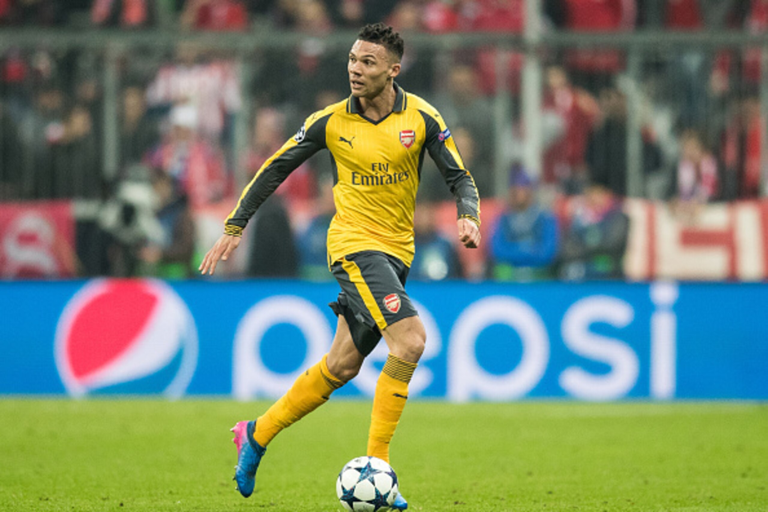 MUNICH, GERMANY - FEBRUARY 15:  Kieran Gibbs of Arsenal runs with the ball during the UEFA Champions League Round of 16 first leg match between FC Bayern Muenchen and Arsenal FC at Allianz Arena on February 15, 2017 in Munich, Germany.  (Photo by Boris St
