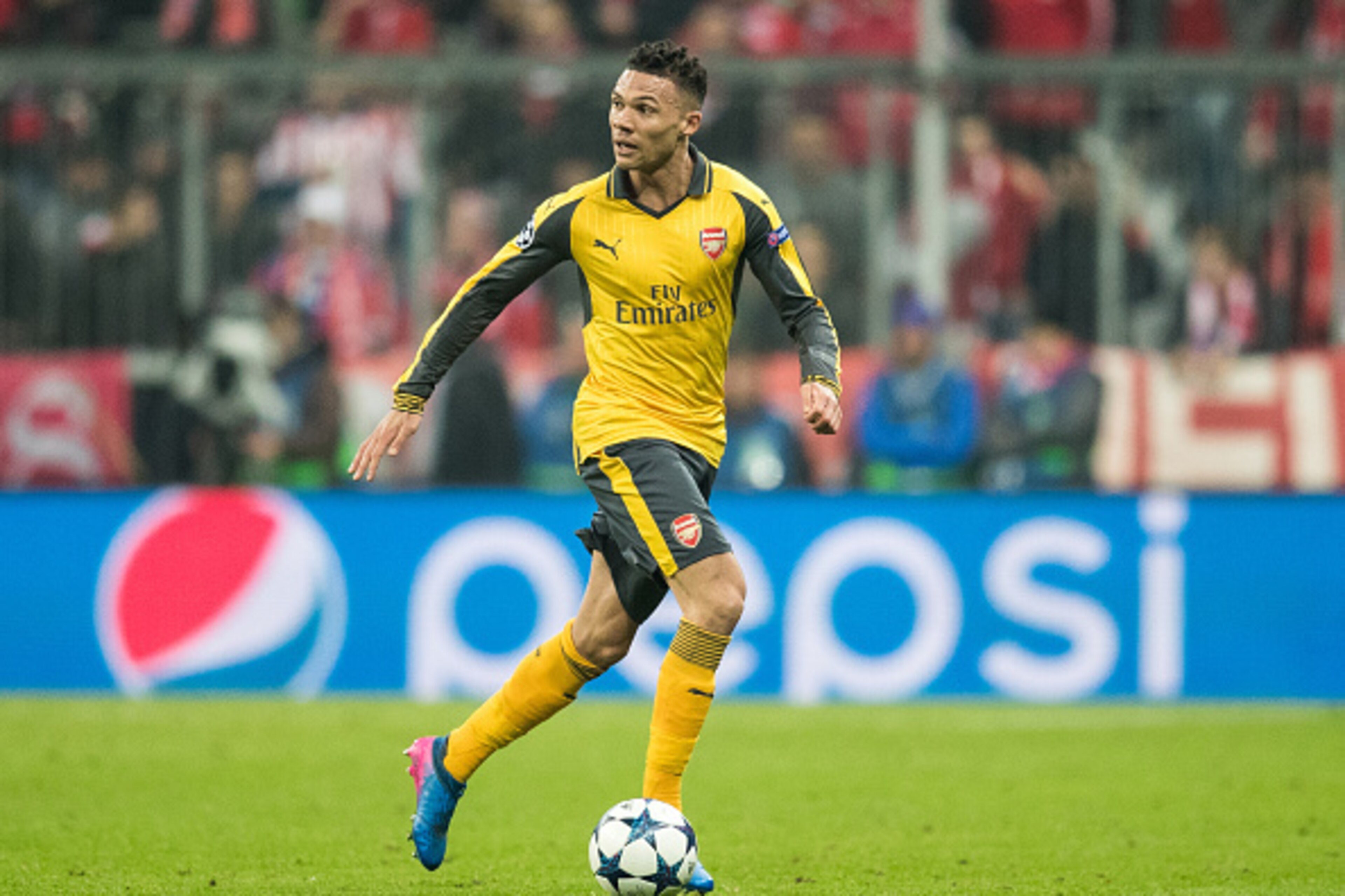 MUNICH, GERMANY - FEBRUARY 15:  Kieran Gibbs of Arsenal runs with the ball during the UEFA Champions League Round of 16 first leg match between FC Bayern Muenchen and Arsenal FC at Allianz Arena on February 15, 2017 in Munich, Germany.  (Photo by Boris St