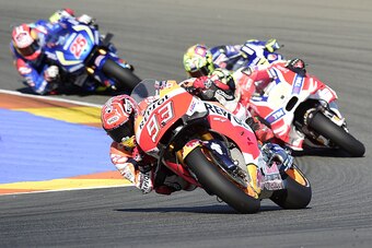 Team Suzuki ECSTAR Maverick Vinales (L), Repsol Honda Team's Spanish rider Marc Marquez (C) Ducati Team's Italian rider Andrea Iannone (R) and Movistar Yamaha MotoGP's Italian rider Valentino Rossi(2R) compete during the MotoGP race of the Spanish Grand P