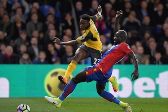 LONDON, ENGLAND - APRIL 10:  Danny Welbeck of Arsenal shoots past Mamadou Sakho of Crystal Palace during the Premier League match between Crystal Palace and Arsenal at Selhurst Park on April 10, 2017 in London, England.  (Photo by Mike Hewitt/Getty Images