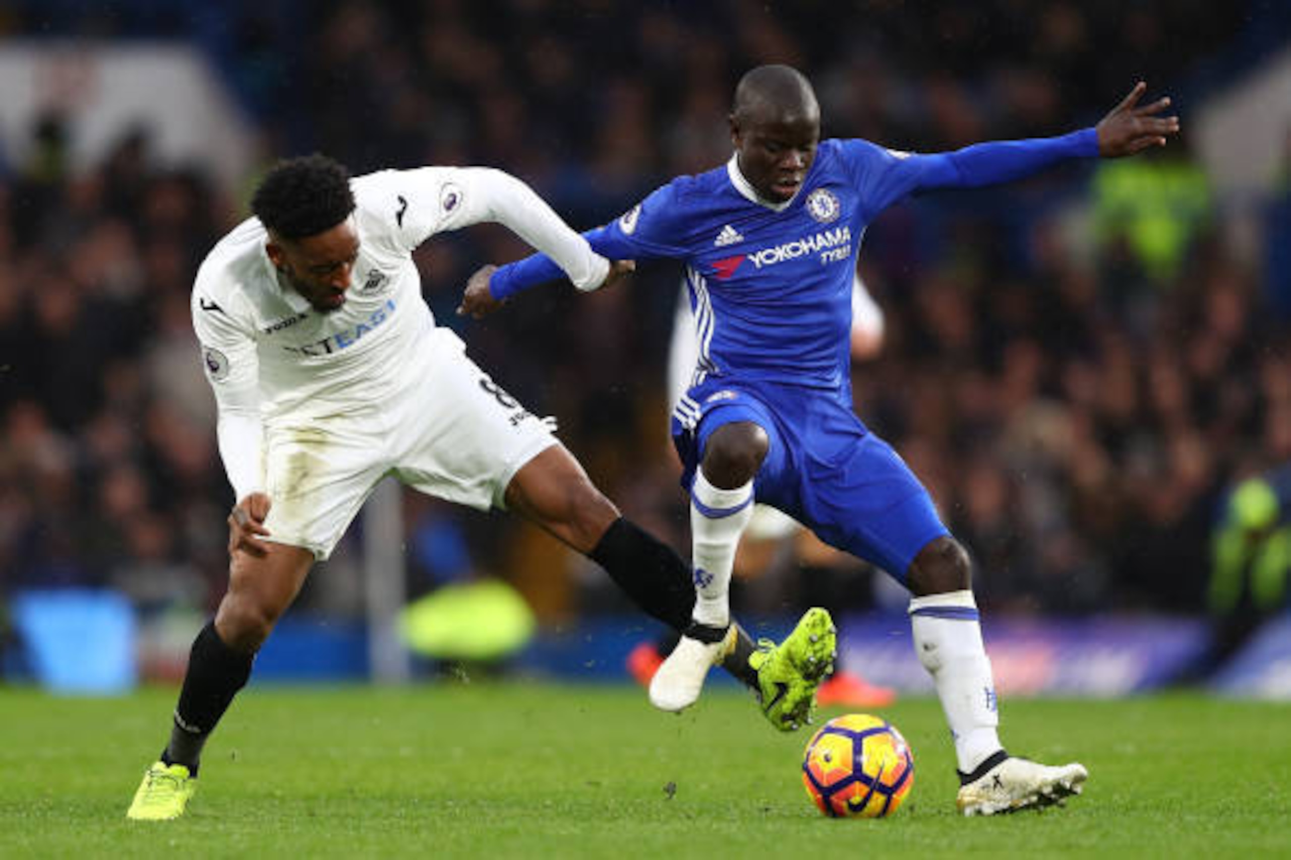 LONDON, ENGLAND - FEBRUARY 25: Leroy Fer of Swansea City (L) and N'Golo Kante of Chelsea (R) battle for possession during the Premier League match between Chelsea and Swansea City at Stamford Bridge on February 25, 2017 in London, England.  (Photo by Cliv
