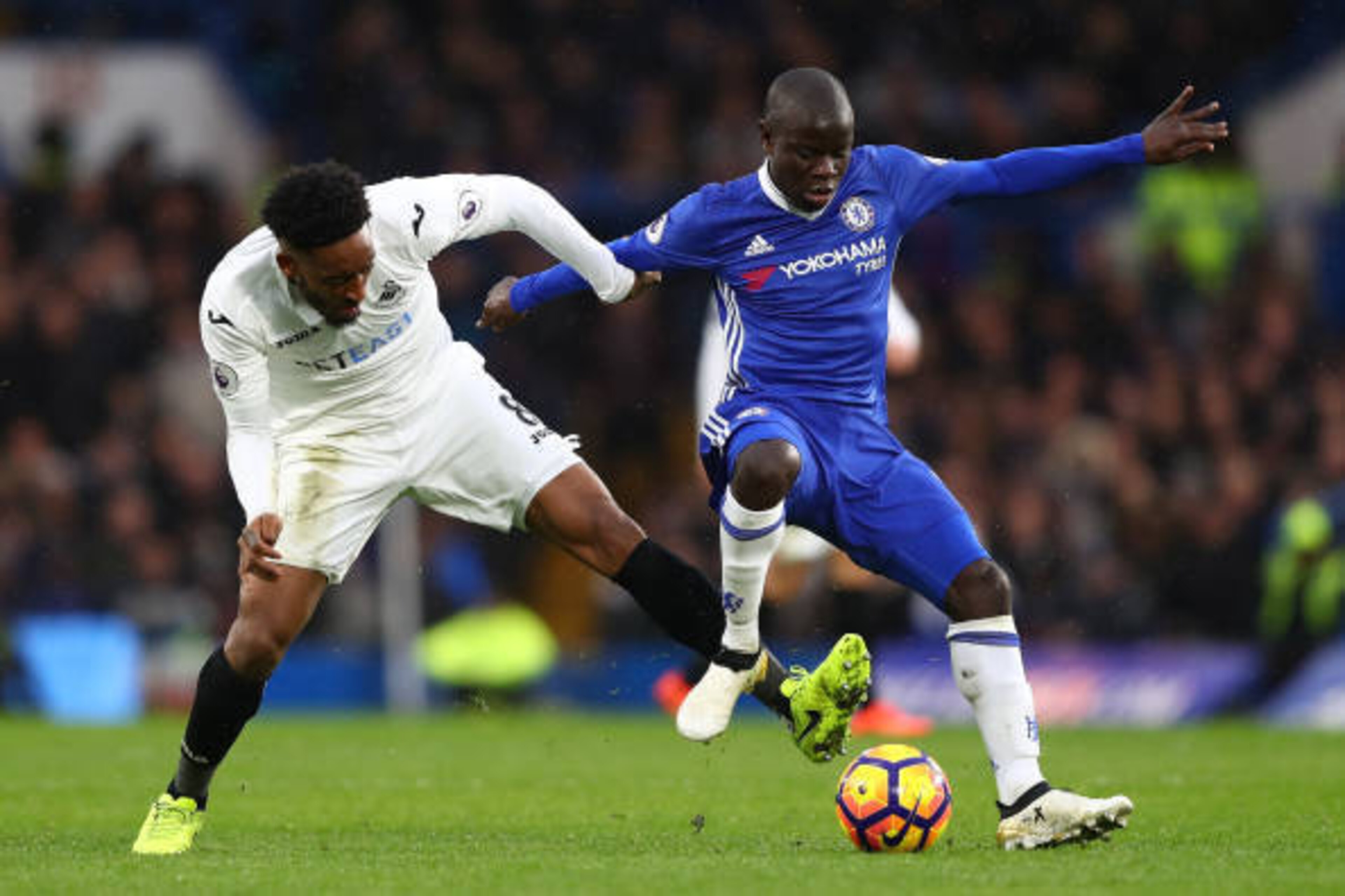 LONDON, ENGLAND - FEBRUARY 25: Leroy Fer of Swansea City (L) and N'Golo Kante of Chelsea (R) battle for possession during the Premier League match between Chelsea and Swansea City at Stamford Bridge on February 25, 2017 in London, England.  (Photo by Cliv