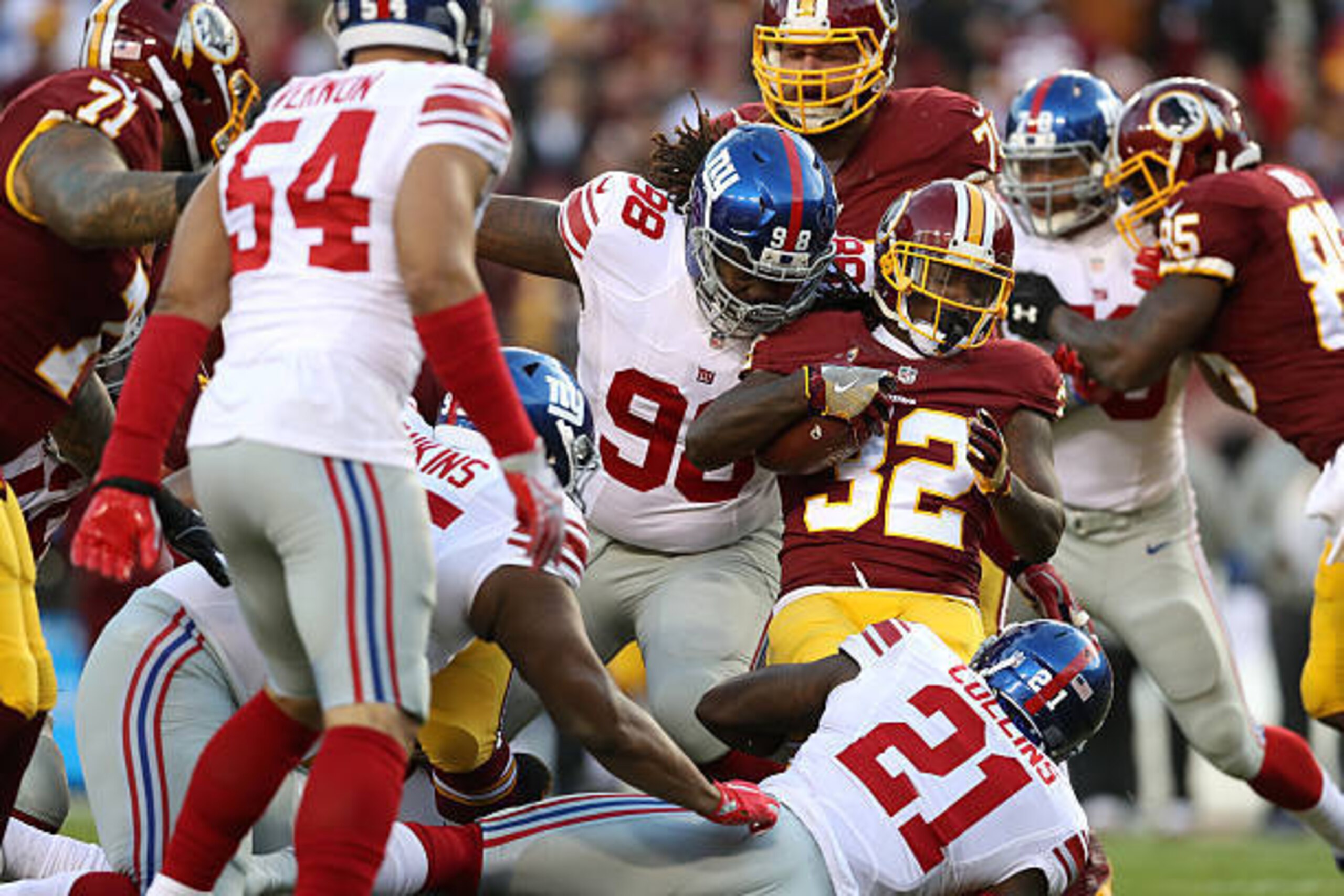 LANDOVER, MD - JANUARY 01: Running back Rob Kelley #32 of the Washington Redskins carries the ball against defensive tackle Damon Harrison #98 of the New York Giants in the first quarter at FedExField on January 1, 2017 in Landover, Maryland. (Photo by Ro