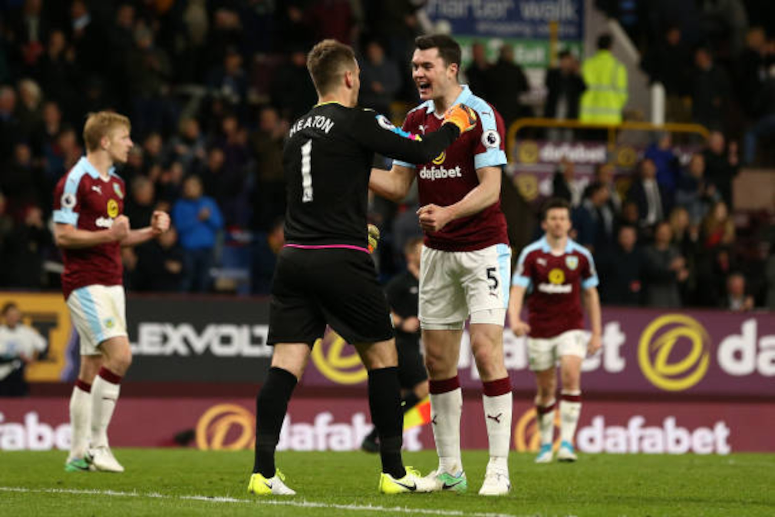 BURNLEY, ENGLAND - APRIL 04: Thomas Heaton of Burnley (L) and Michael Keane of Burnley (R) celebrate together after the Premier League match between Burnley and Stoke City at Turf Moor on April 4, 2017 in Burnley, England.  (Photo by Jan Kruger/Getty Imag