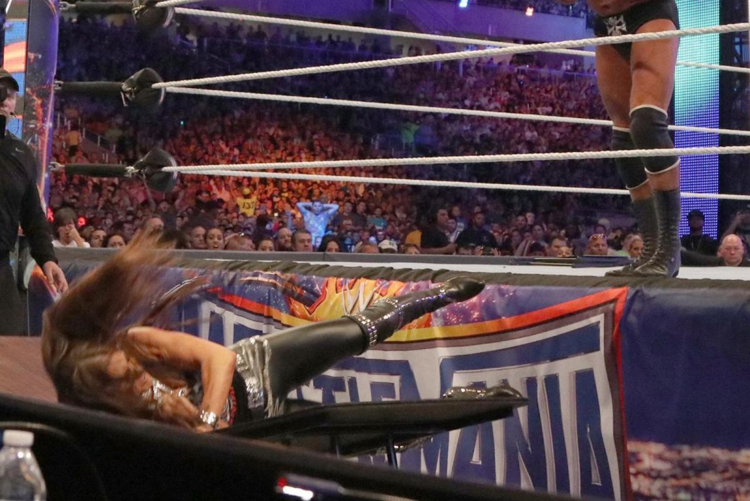 Stephanie McMahon takes a dive into a table at WrestleMania 33.