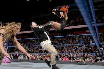 Becky Lynch hits James Ellsworth with a missile dropkick.