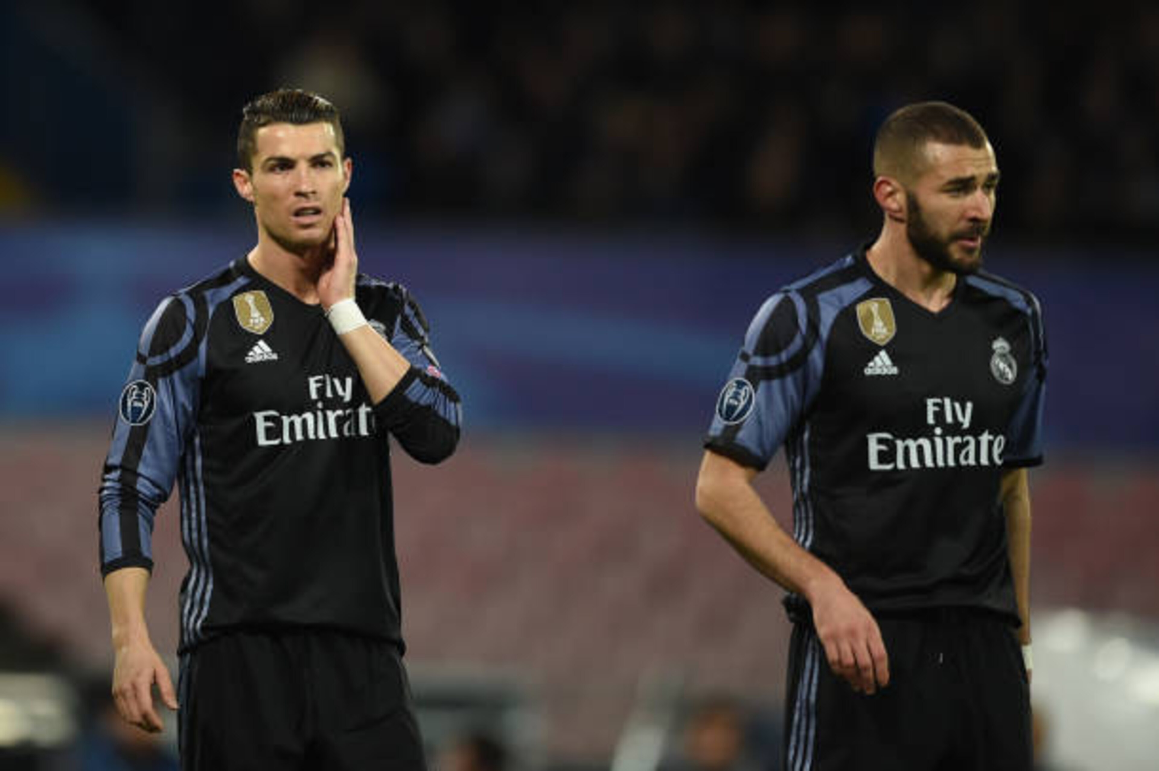 Real Madrid's Portuguese forward Cristiano Ronaldo and Real Madrid's French forward Karim Benzema (R) look on during the UEFA Champions League football match SSC Napoli vs Real Madrid on March 7, 2017 at the San Paolo stadium in Naples. Real Madrid won 1-