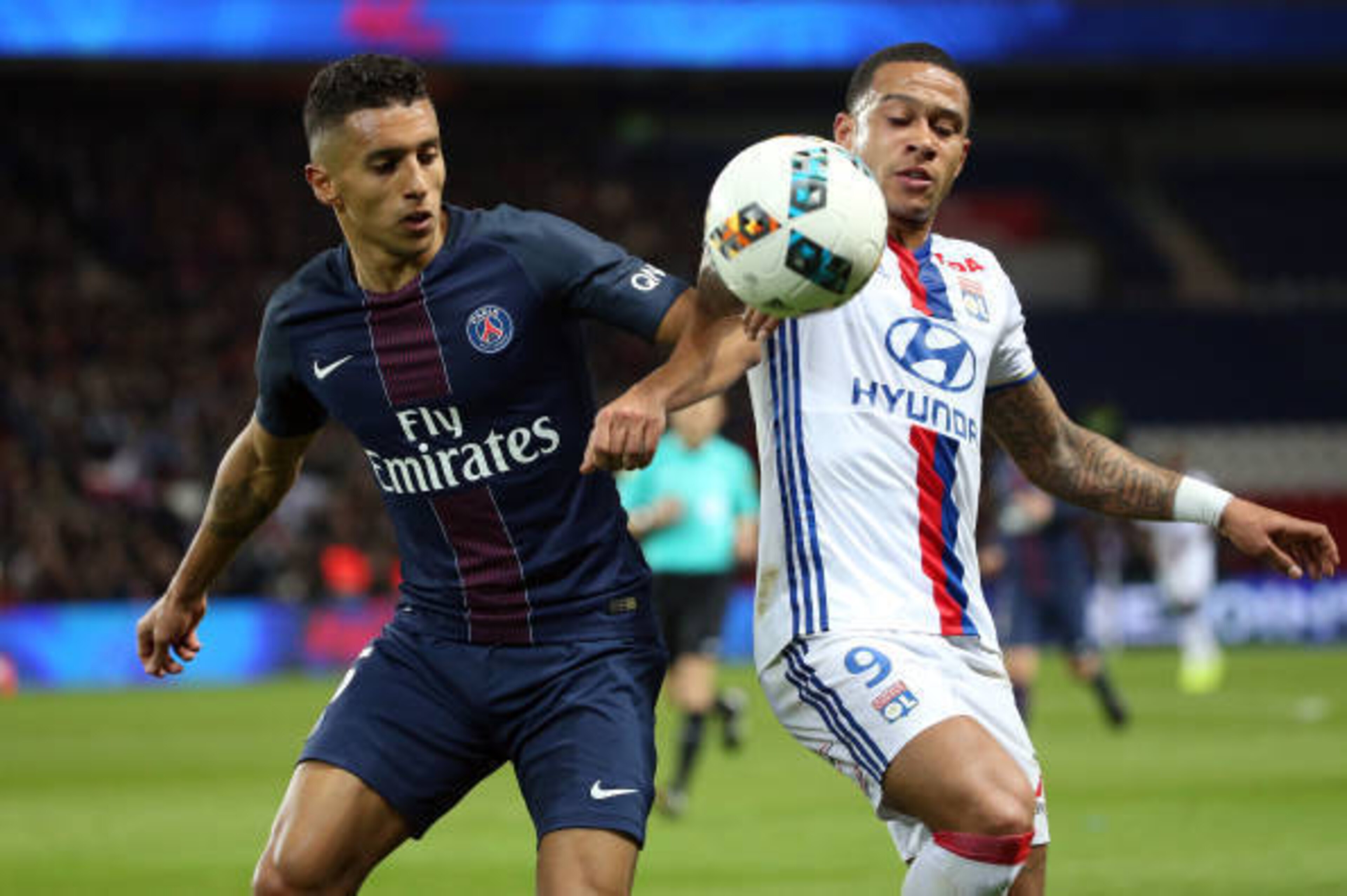 PARIS, FRANCE - MARCH 19: Marquinhos of PSG and Memphis Depay of Lyon in action during the French Ligue 1 match between Paris Saint-Germain (PSG) and Olympique Lyonnais (OL) at Parc des Princes stadium on March 19, 2017 in Paris, France. (Photo by Jean Ca PARIS, FRANCE - MARCH 19: Marquinhos of PSG and Memphis Depay of Lyon in action during the French Ligue 1 match between Paris Saint-Germain (PSG) and Olympique Lyonnais (OL) at Parc des Princes stadium on March 19, 2017 in Paris, France. (Photo by Jean Ca
