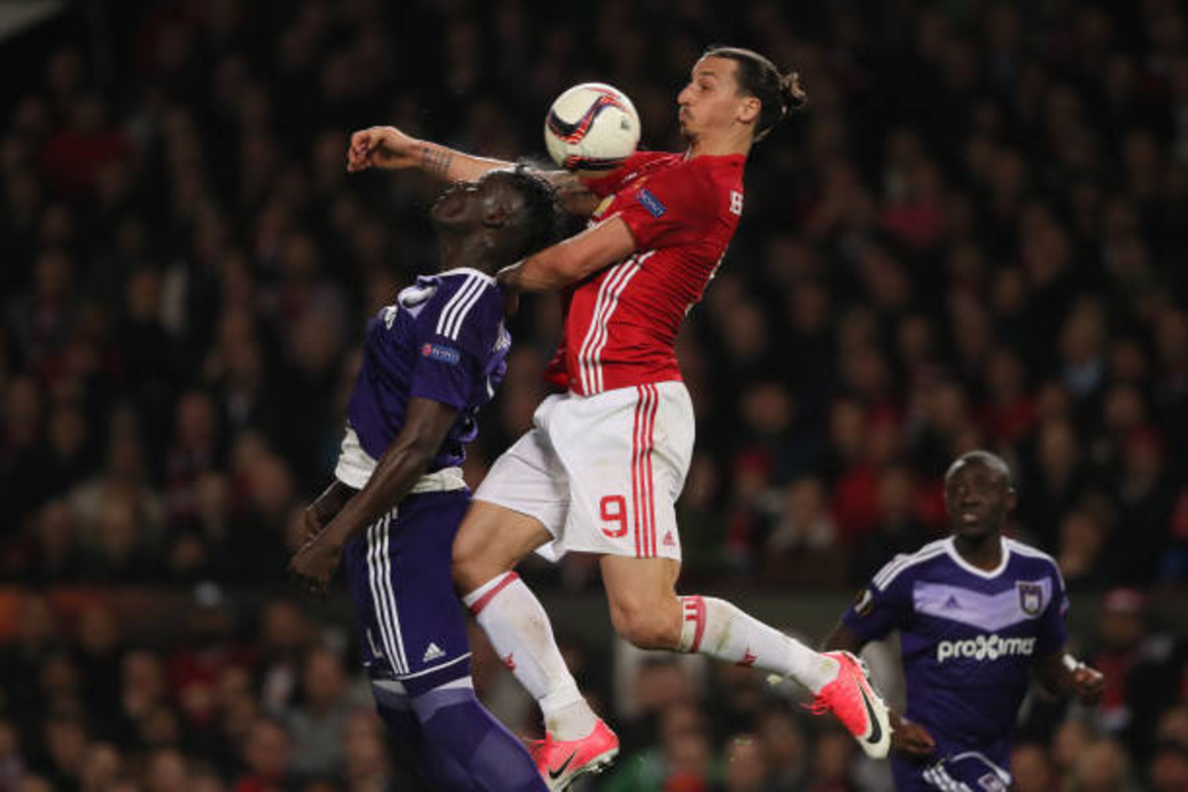 MANCHESTER, ENGLAND - APRIL 20: Zlatan Ibrahimovic of Manchester United competes with Kara Mbodji of Anderlecht in the air during the UEFA Europa League quarter final second leg match between Manchester United and RSC Anderlecht at Old Trafford on March MANCHESTER, ENGLAND - APRIL 20: Zlatan Ibrahimovic of Manchester United competes with Kara Mbodji of Anderlecht in the air during the UEFA Europa League quarter final second leg match between Manchester United and RSC Anderlecht at Old Trafford on March