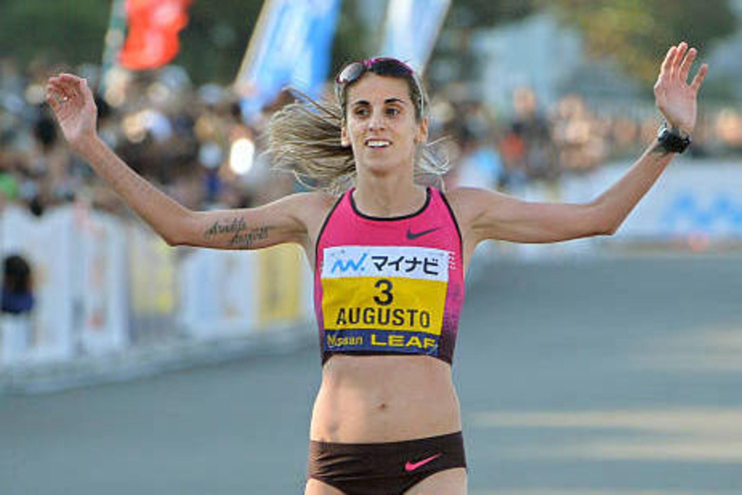 Portugal's Jessica Augusto crosses the finish line in the Yokohama Women's Marathon on November 17, 2013. Augusto finished third with a time of 2 hours:29 minutes:11 seconds. AFP PHOTO / KAZUHIRO NOGI        (Photo credit should read KAZUHIRO NOGI/AFP/Get