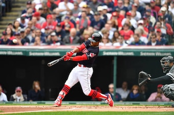 CLEVELAND, OH - APRIL 11: Francisco Lindor #12 of the Cleveland Indians hits a solo home run during the first inning against the Chicago White Sox during the Cleveland Indians home opening game at Progressive Field on April 11, 2017 in Cleveland, Ohio. (P