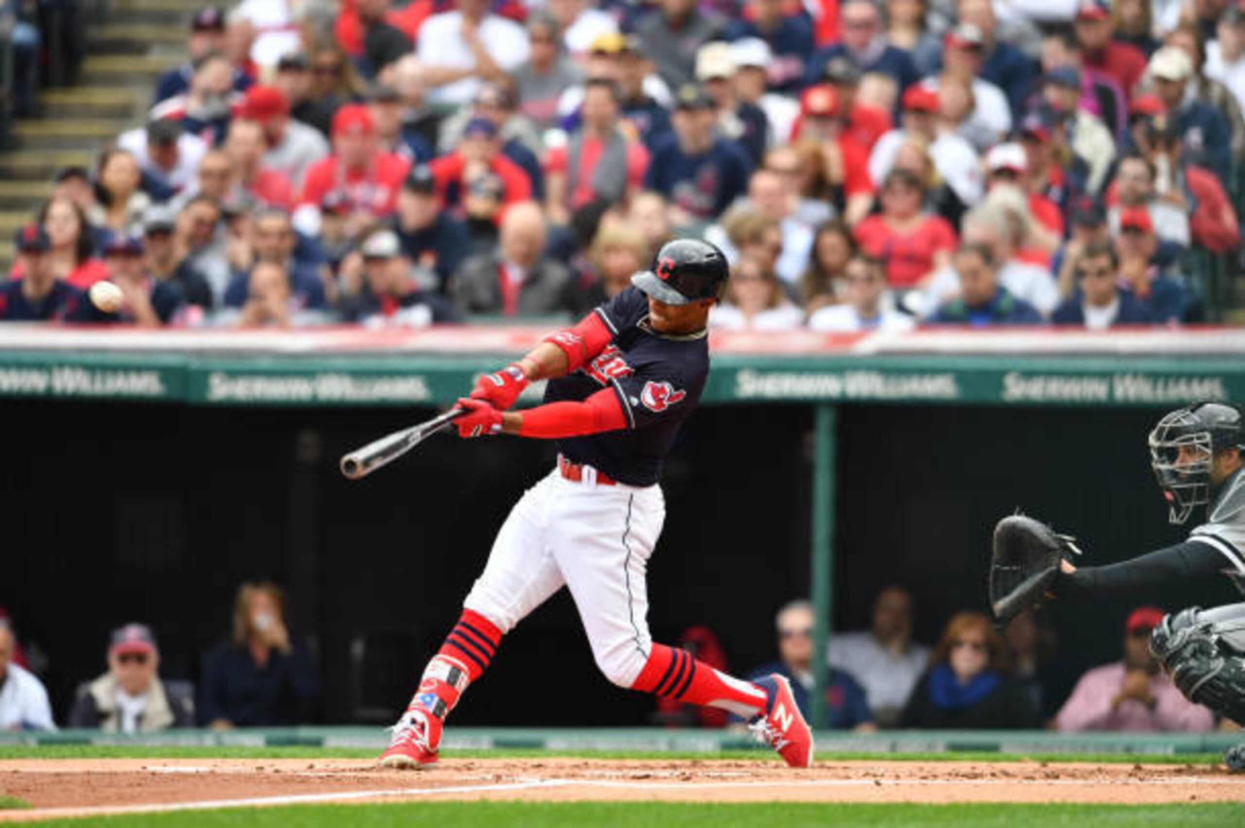CLEVELAND, OH - APRIL 11: Francisco Lindor #12 of the Cleveland Indians hits a solo home run during the first inning against the Chicago White Sox during the Cleveland Indians home opening game at Progressive Field on April 11, 2017 in Cleveland, Ohio. (P