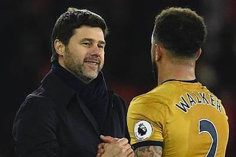 Tottenham Hotspur's Argentinian head coach Mauricio Pochettino (L) shakes hands with Tottenham Hotspur's English defender Kyle Walker (R) at the end of the English Premier League football match between Southampton and Tottenham Hotspur at St Mary's Stadiu