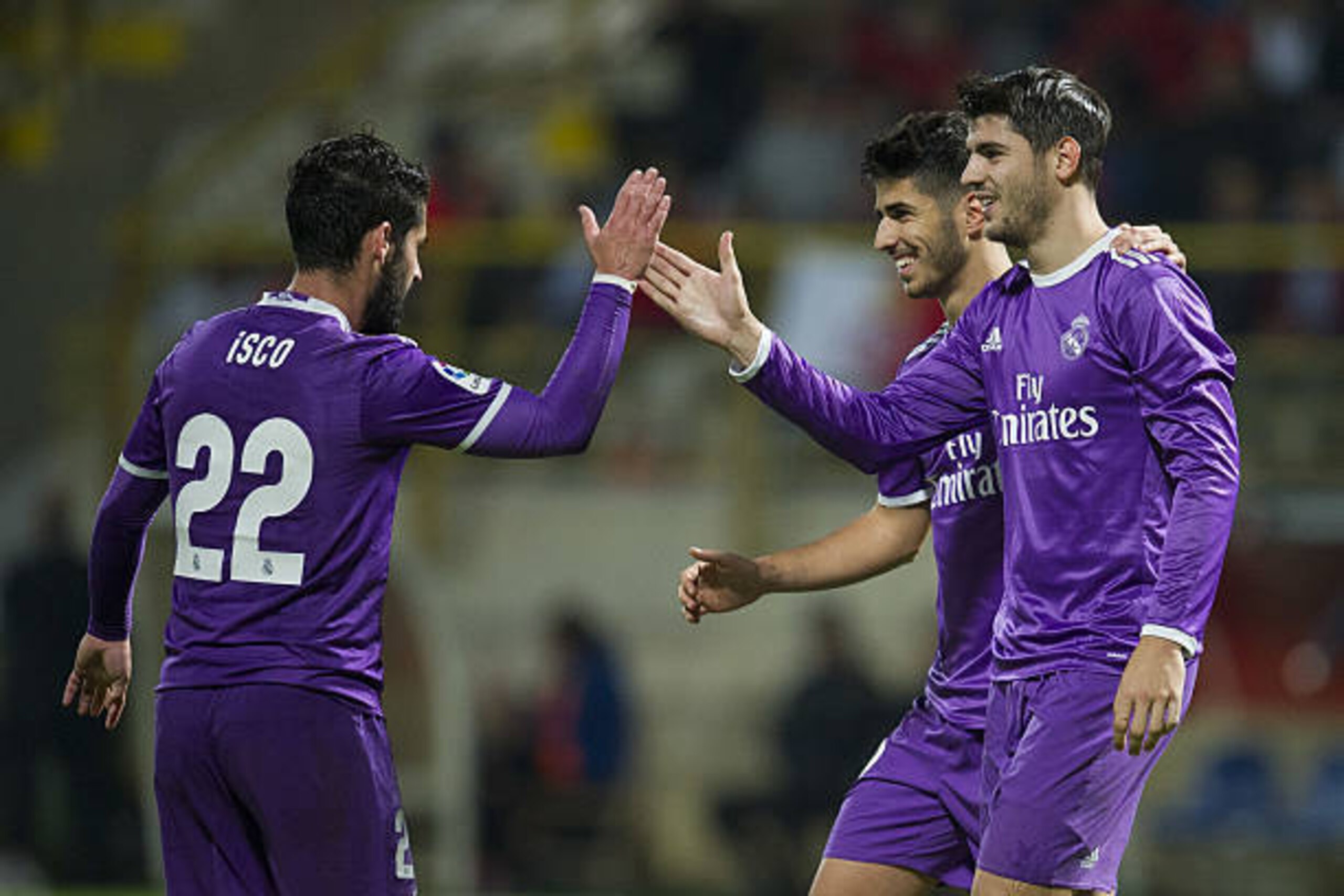 LEON, SPAIN - OCTOBER 26:  Alvaro Morata of Real Madrid celebrates with his teammates Marco Asensio and Isco of Real Madrid after scoring his team's fifth goal during the Copa del Rey Round of 32 match between Cultural Leonesa and Real Madrid CF at Reino 
