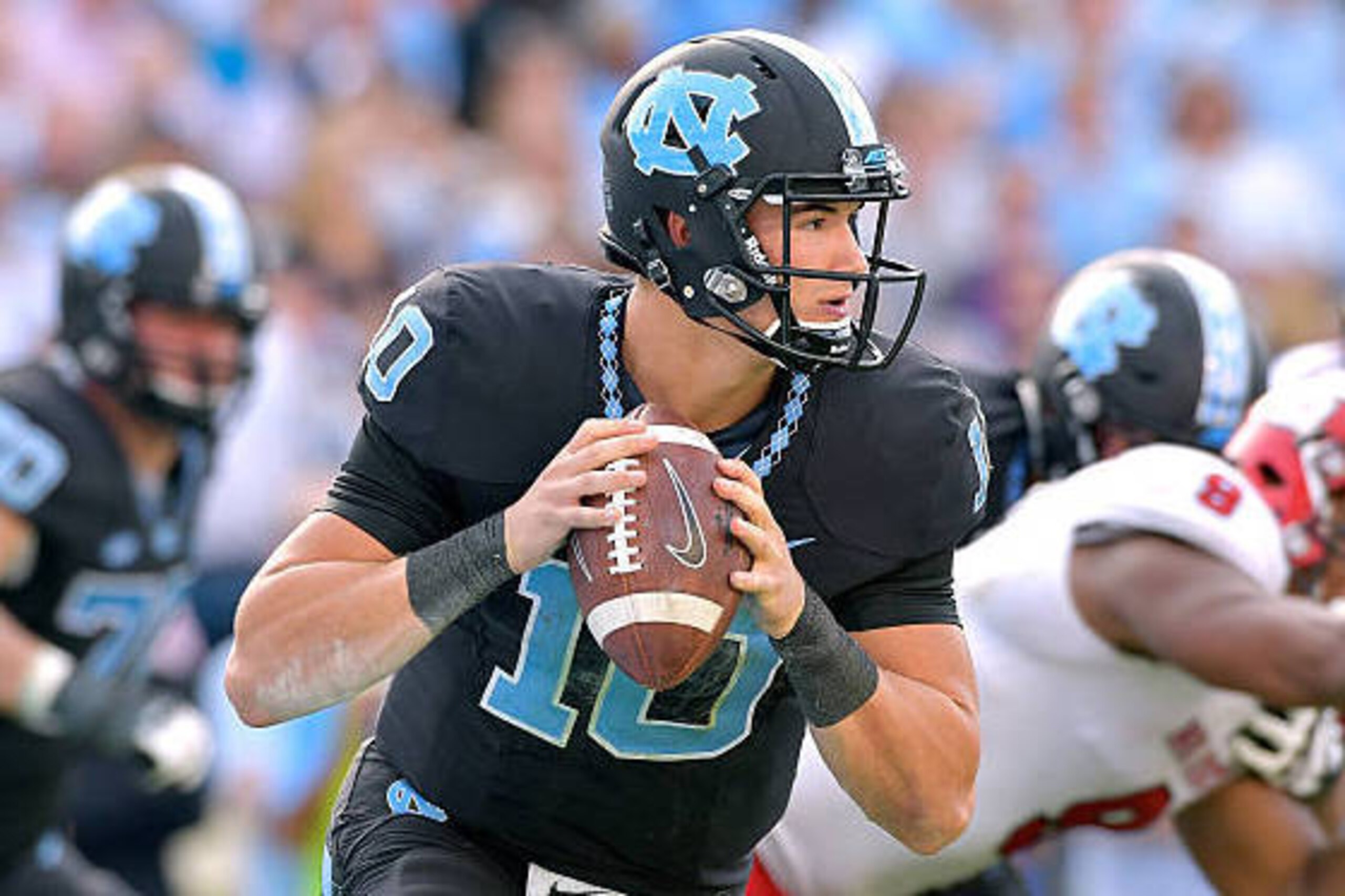 CHAPEL HILL, NC - NOVEMBER 25:  Mitch Trubisky #10 of the North Carolina Tar Heels against the North Carolina State Wolfpack during their game at Kenan Stadium on November 25, 2016 in Chapel Hill, North Carolina. North Carolina State won 28-21.  (Photo by