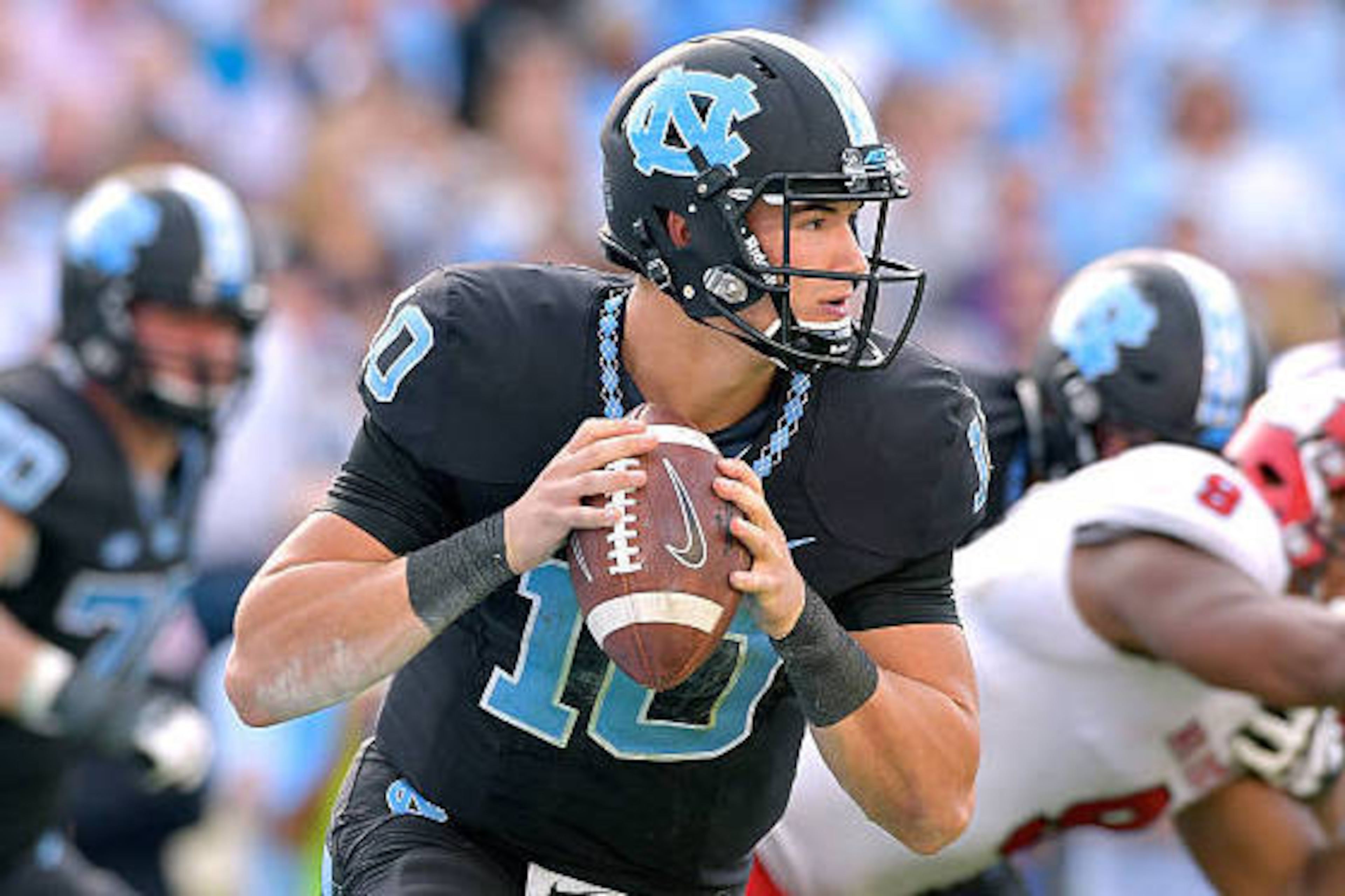 CHAPEL HILL, NC - NOVEMBER 25:  Mitch Trubisky #10 of the North Carolina Tar Heels against the North Carolina State Wolfpack during their game at Kenan Stadium on November 25, 2016 in Chapel Hill, North Carolina. North Carolina State won 28-21.  (Photo by