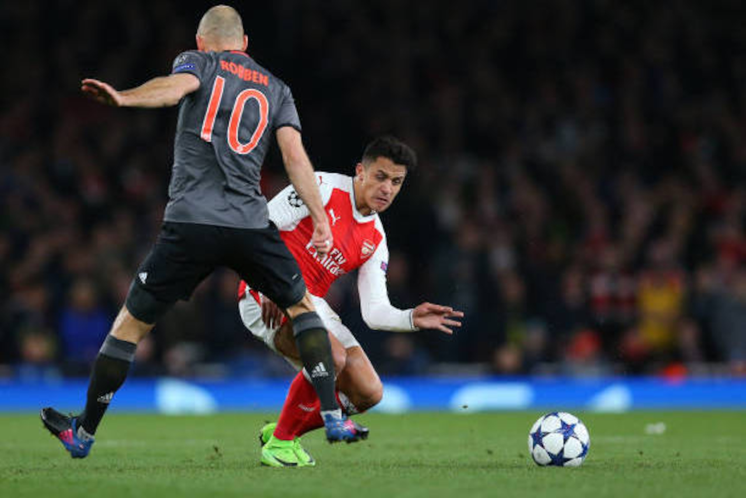 LONDON, ENGLAND - MARCH 07: Alexis Sanchez of Arsenal and Arjen Robben of Bayern Munich during the UEFA Champions League Round of 16 second leg match between Arsenal FC and FC Bayern Muenchen at Emirates Stadium on March 7, 2017 in London, United Kingdom.