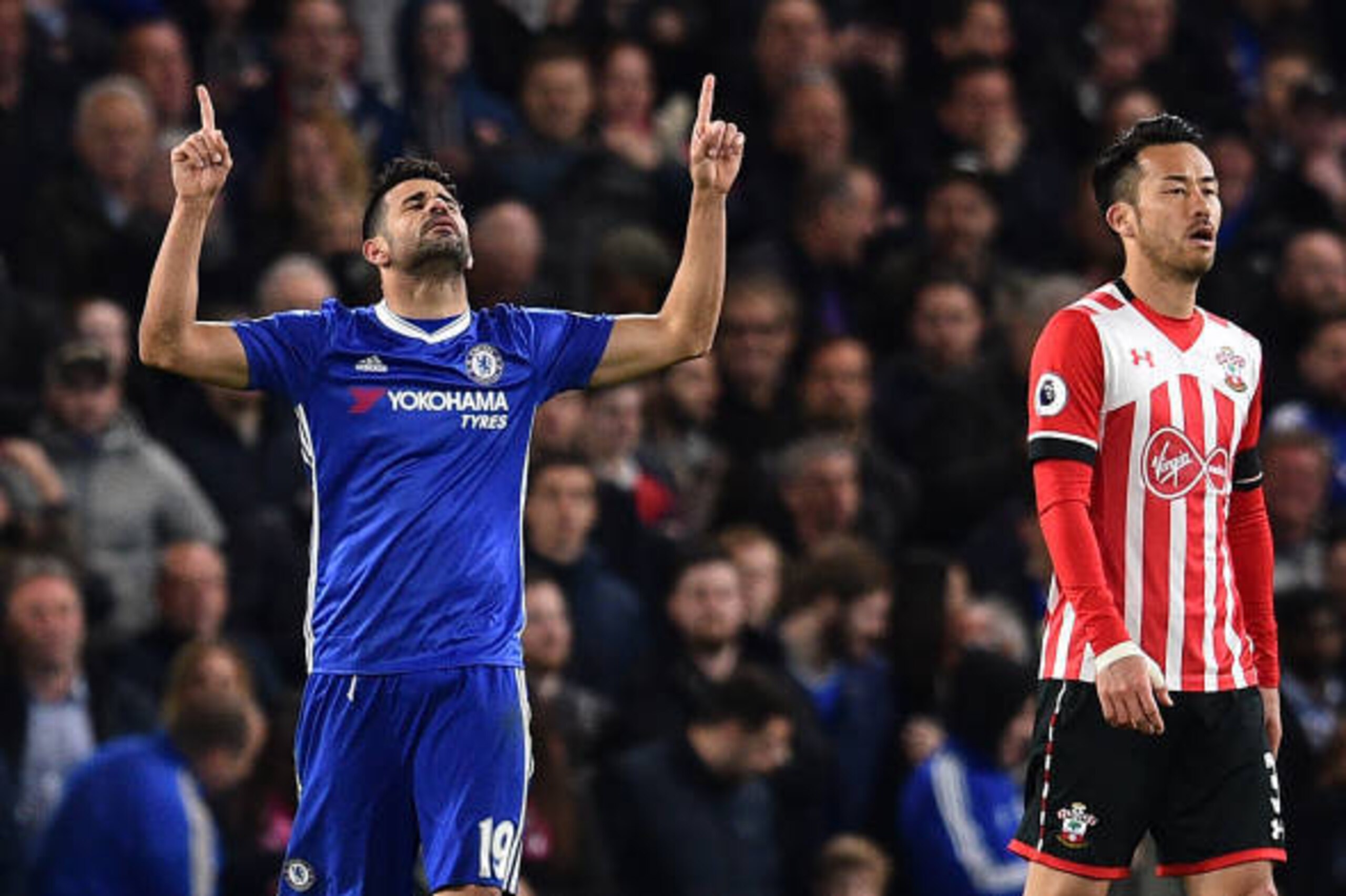 Chelsea's Brazilian-born Spanish striker Diego Costa celebrates after scoring their third goal during the English Premier League football match between Chelsea and Southampton at Stamford Bridge in London on April 25, 2017. / AFP PHOTO / Glyn KIRK / RESTR
