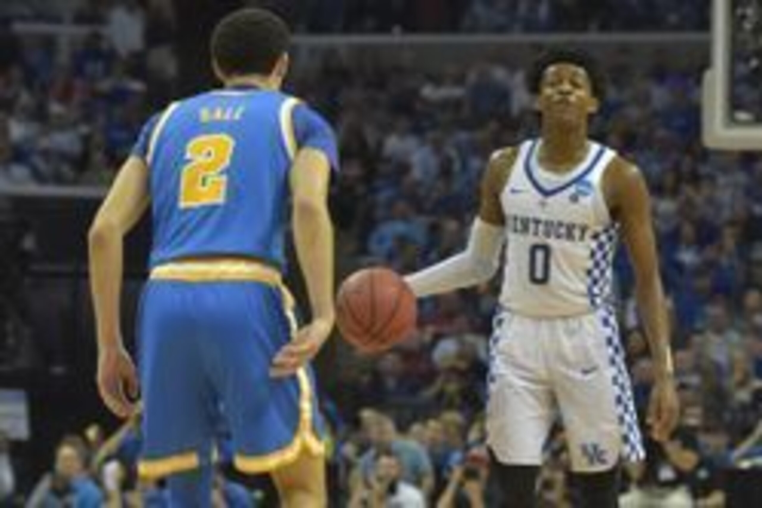 Mar 24, 2017; Memphis, TN, USA; Kentucky Wildcats guard De'Aaron Fox (0) looks to pass the ball against UCLA Bruins guard Lonzo Ball (2) in the second half during the semifinals of the South Regional of the 2017 NCAA Tournament at FedExForum. Mandatory Cr